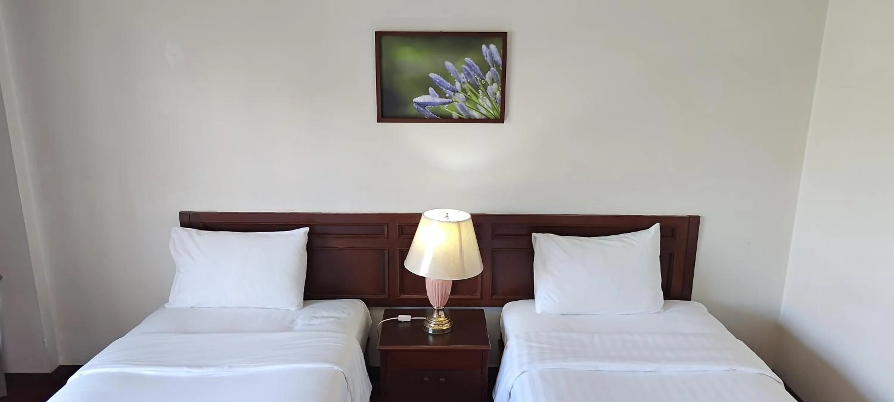 Bed in Puangpen Villa Hotel