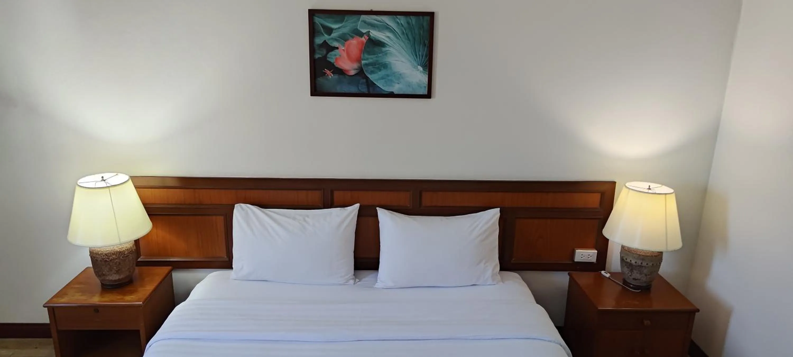 Bed in Puangpen Villa Hotel