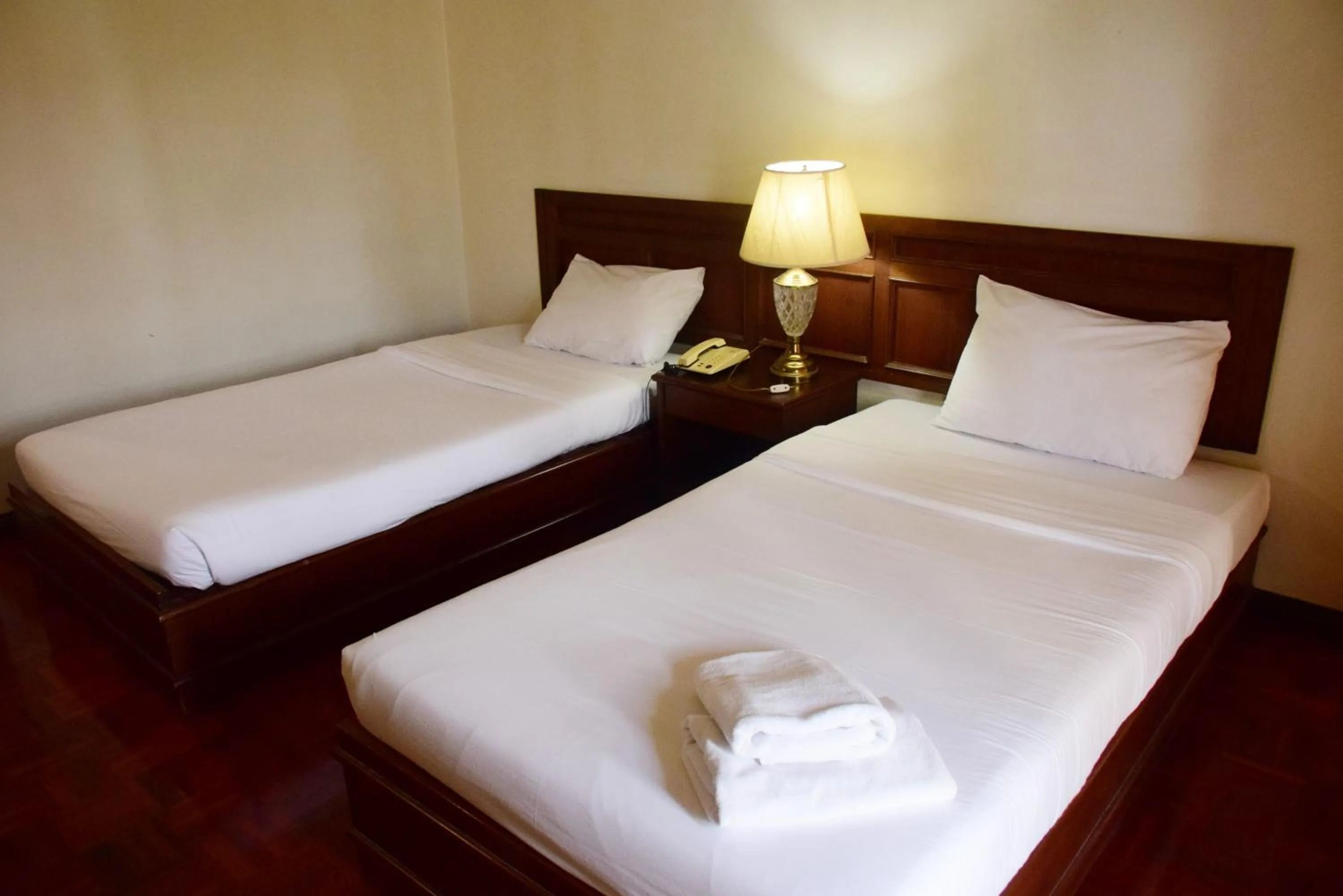 Bed in Puangpen Villa Hotel