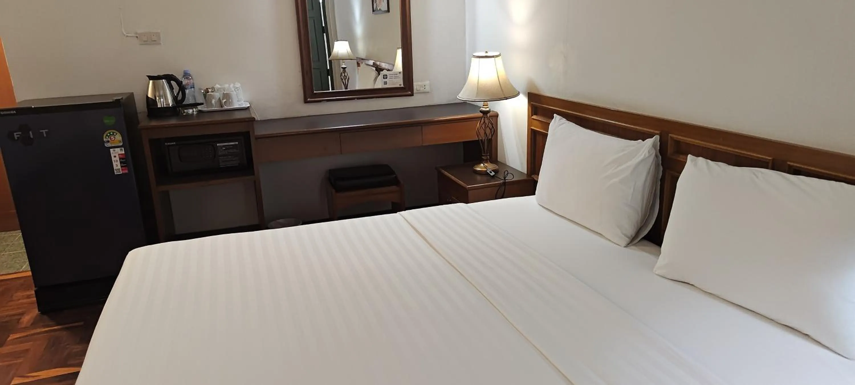 Bed in Puangpen Villa Hotel