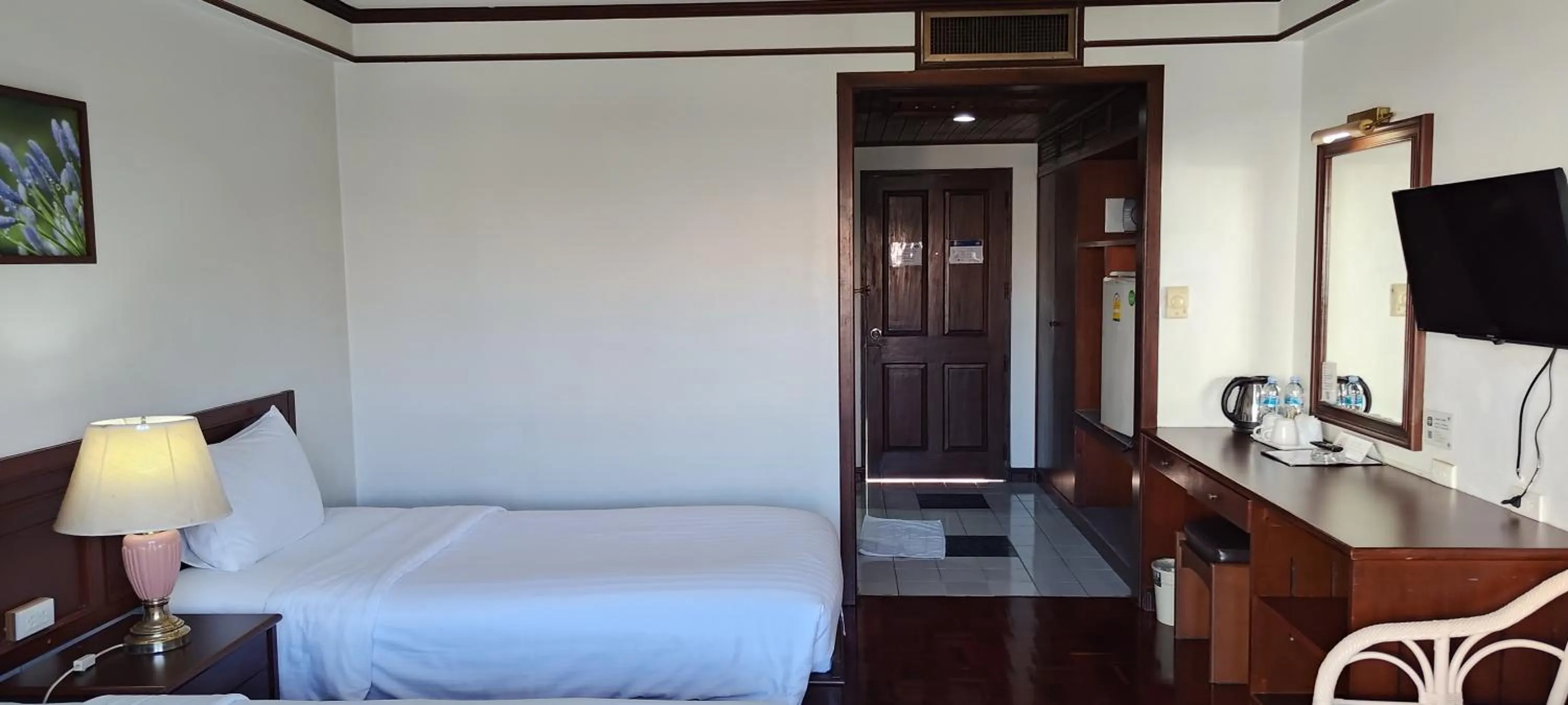 Bed in Puangpen Villa Hotel