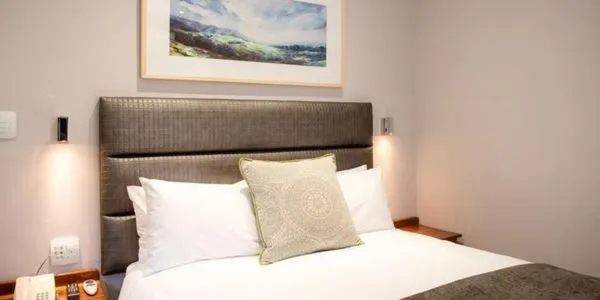 Bed in Palm Park Hotel