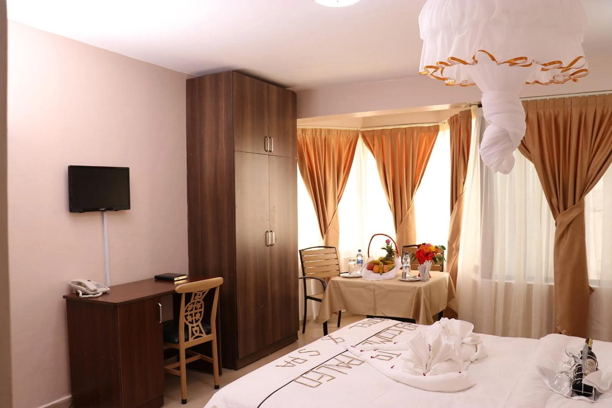 Photo of the whole room, TV/Entertainment Center in Paleo Hotel and Spa