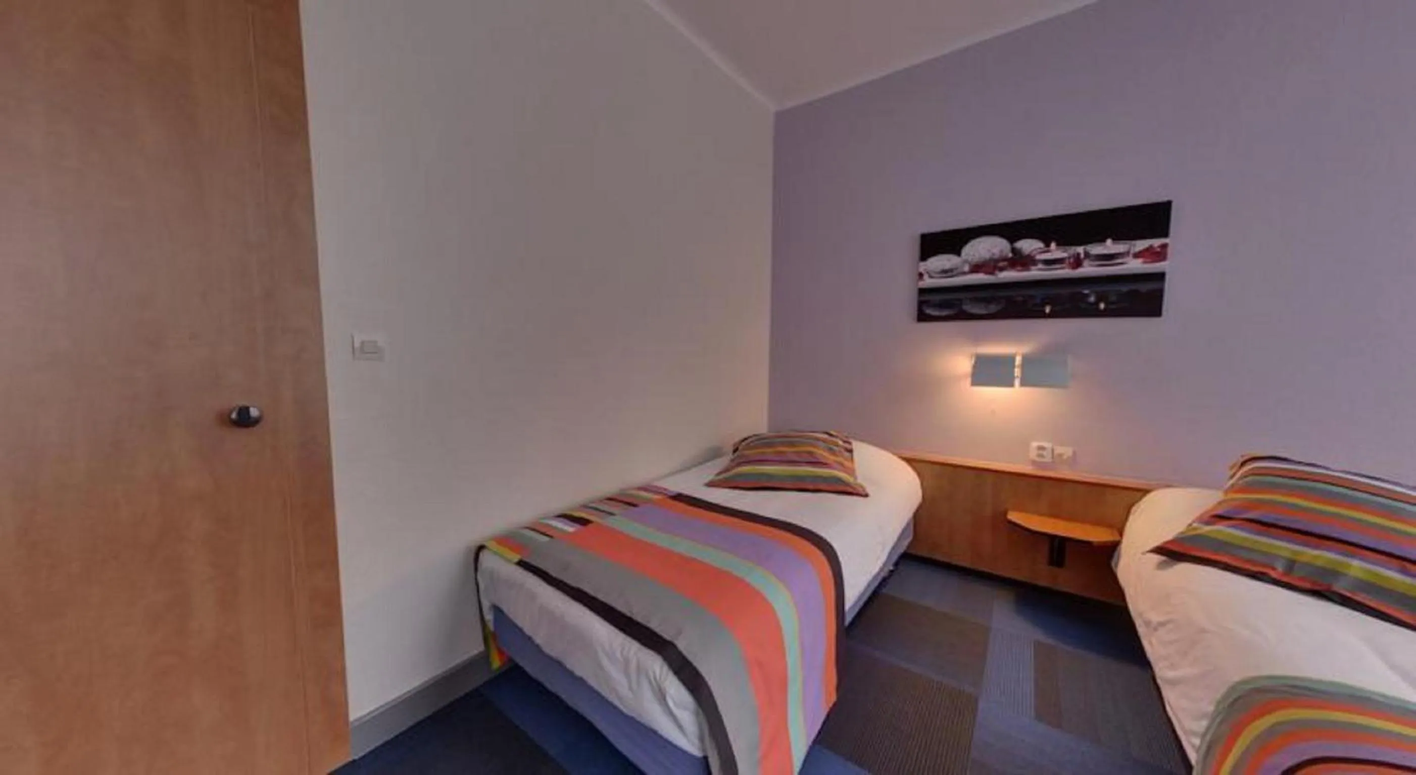 Bed in Logis Hotel de Paris