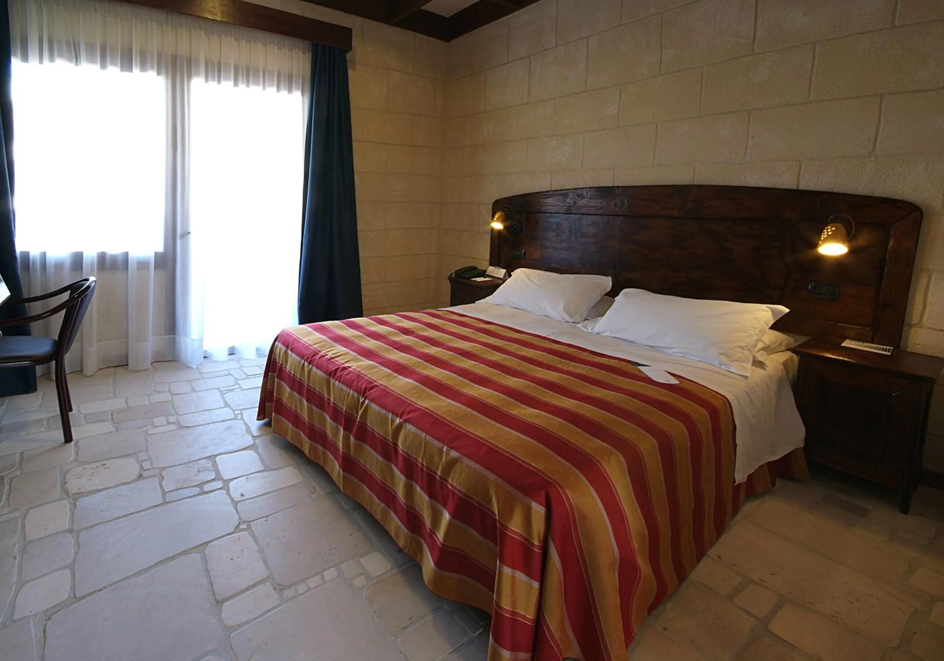 Bed in UNA HOTELS Regina Bari