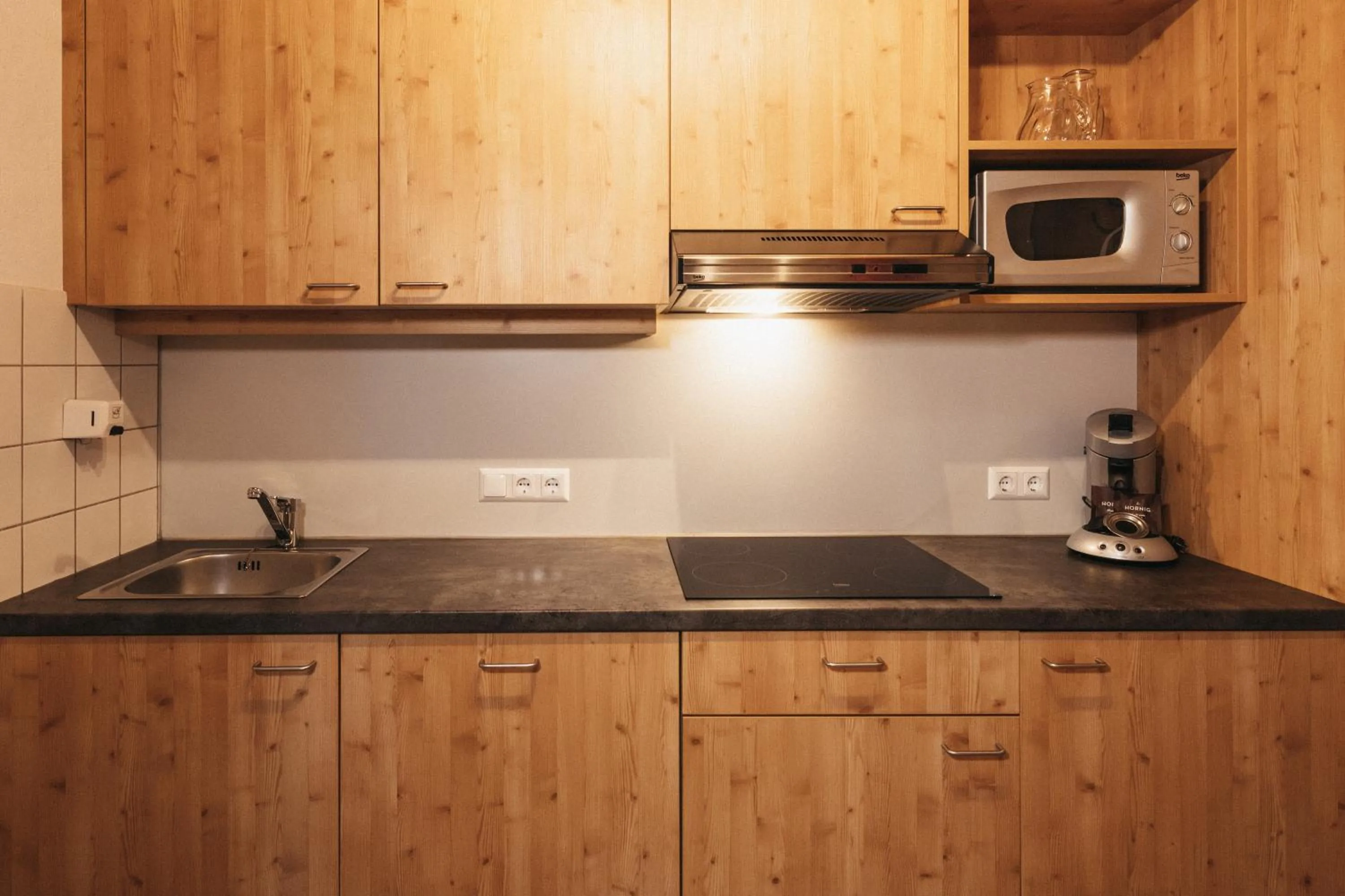 Kitchen or kitchenette in Naturel Hoteldorf Seeleitn