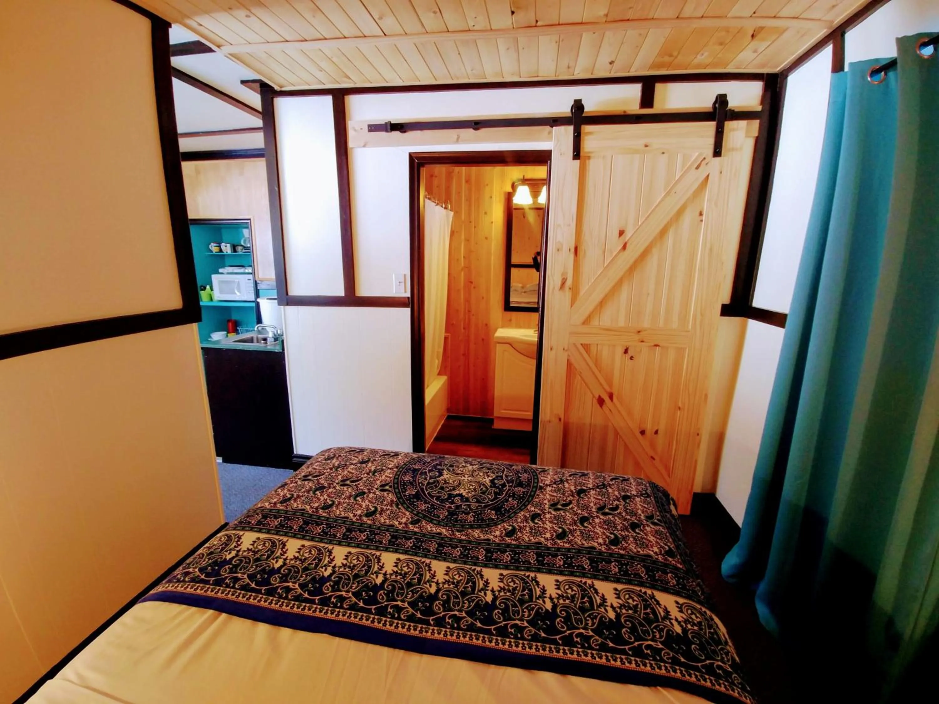 Bed in Dwight Riverside Inn