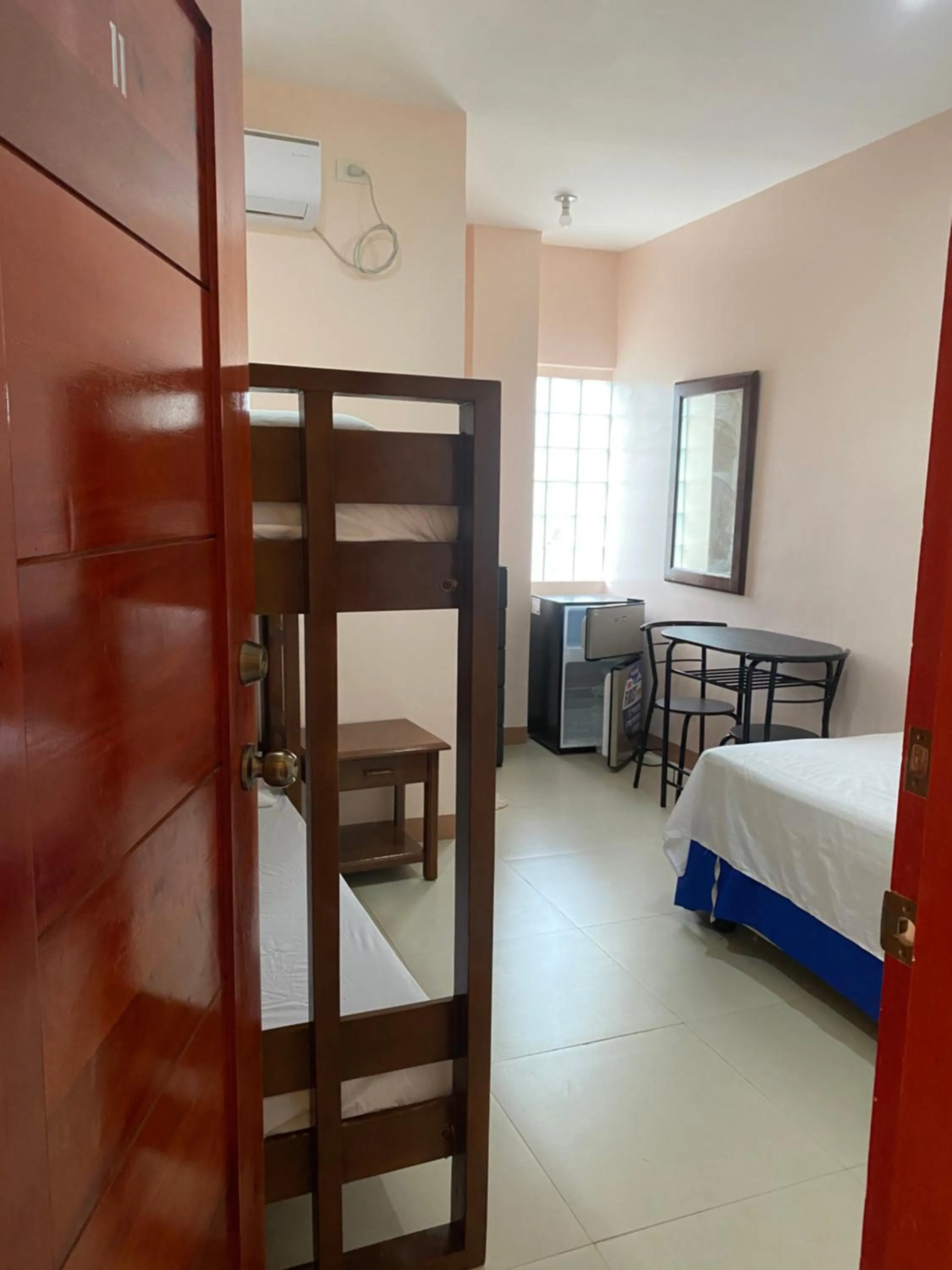 Bed in Kellocks' Seaview Apartelle