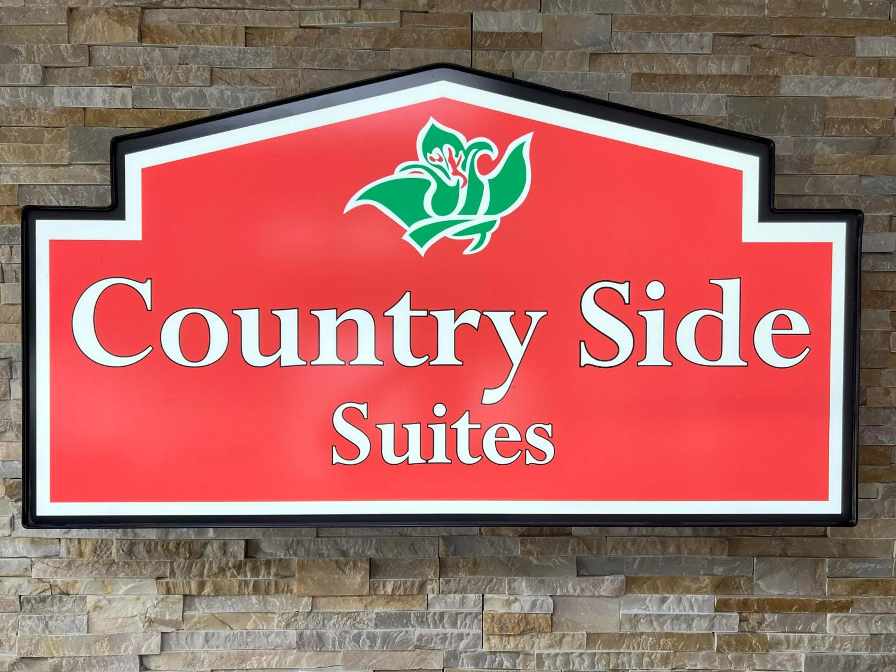 Property logo or sign in Countryside Suites Kansas City Independence I-70 East Sports Complex Hotel
