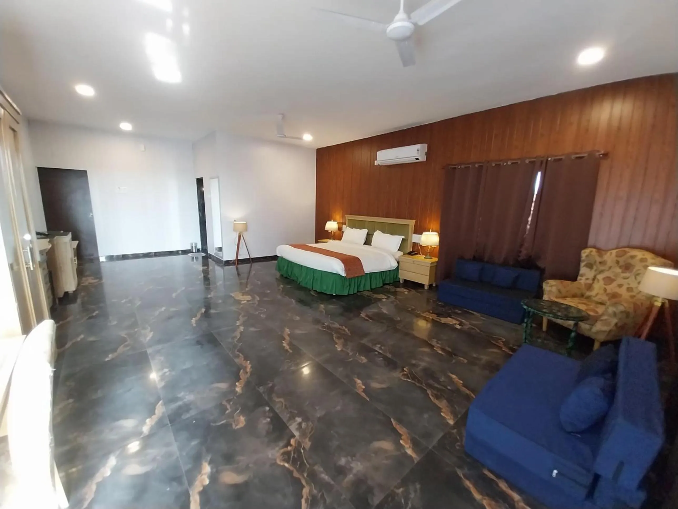 Bed in Mango Valley Resort Ganpatipule