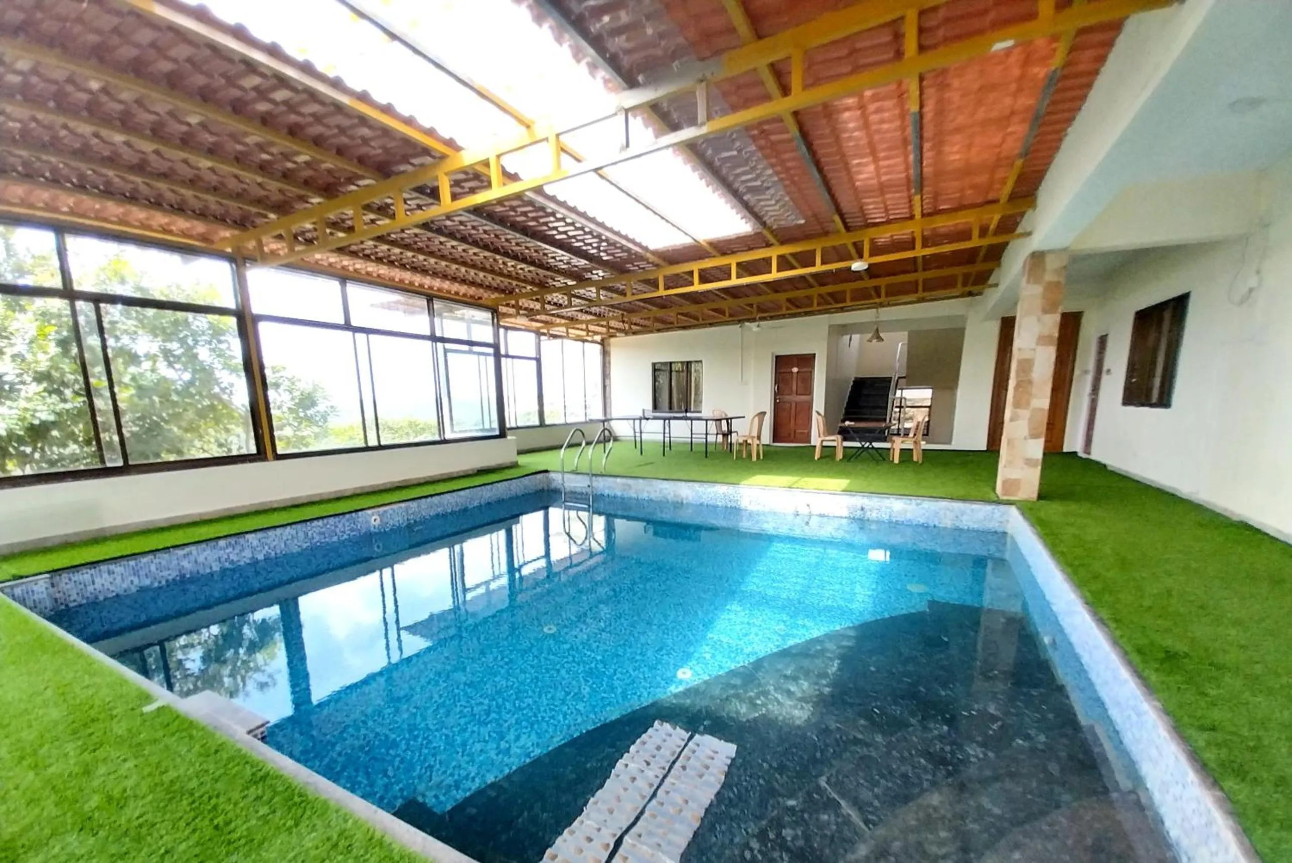 Swimming pool in Mango Valley Resort Ganpatipule