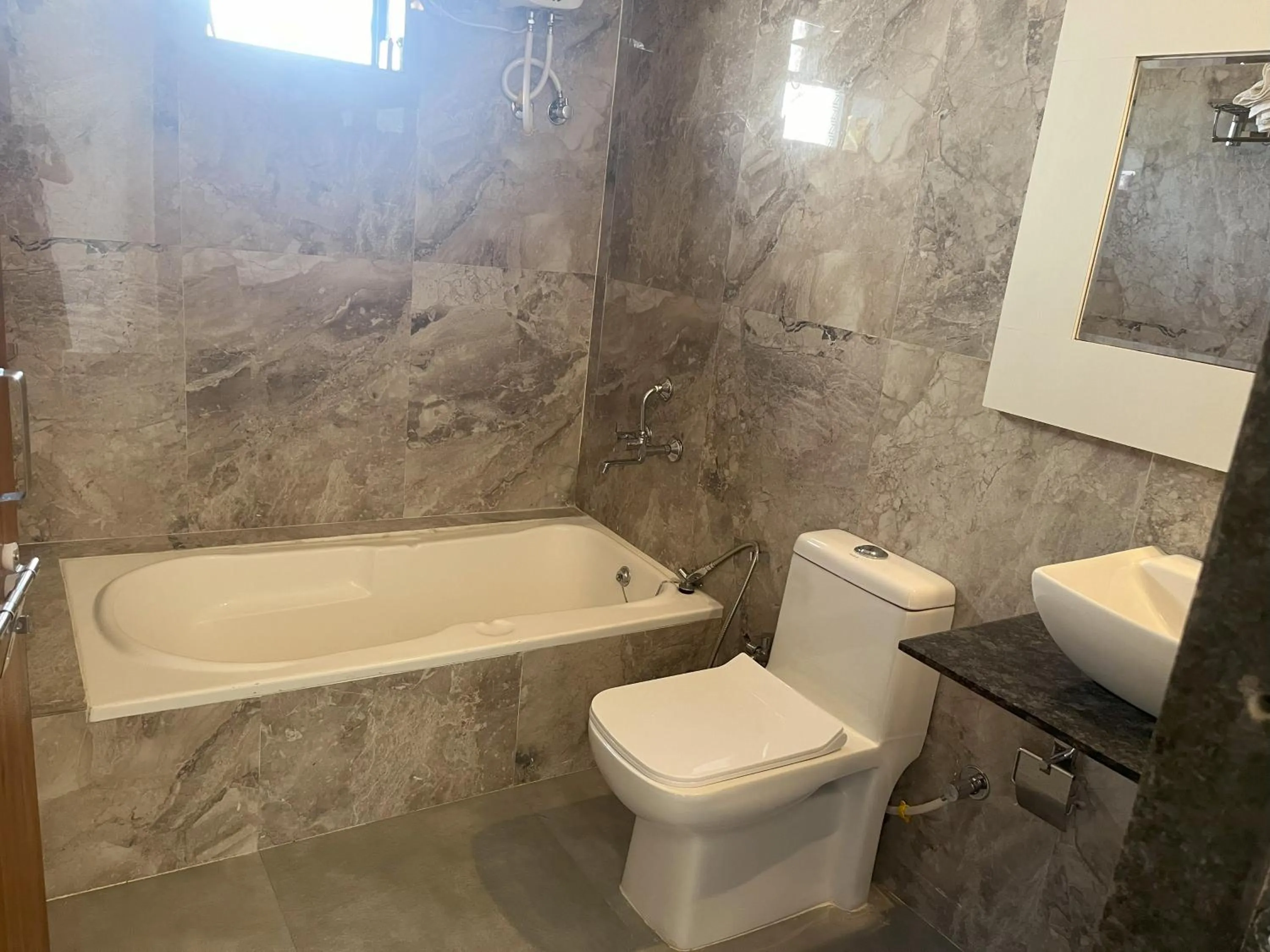 Toilet in Mango Valley Resort Ganpatipule