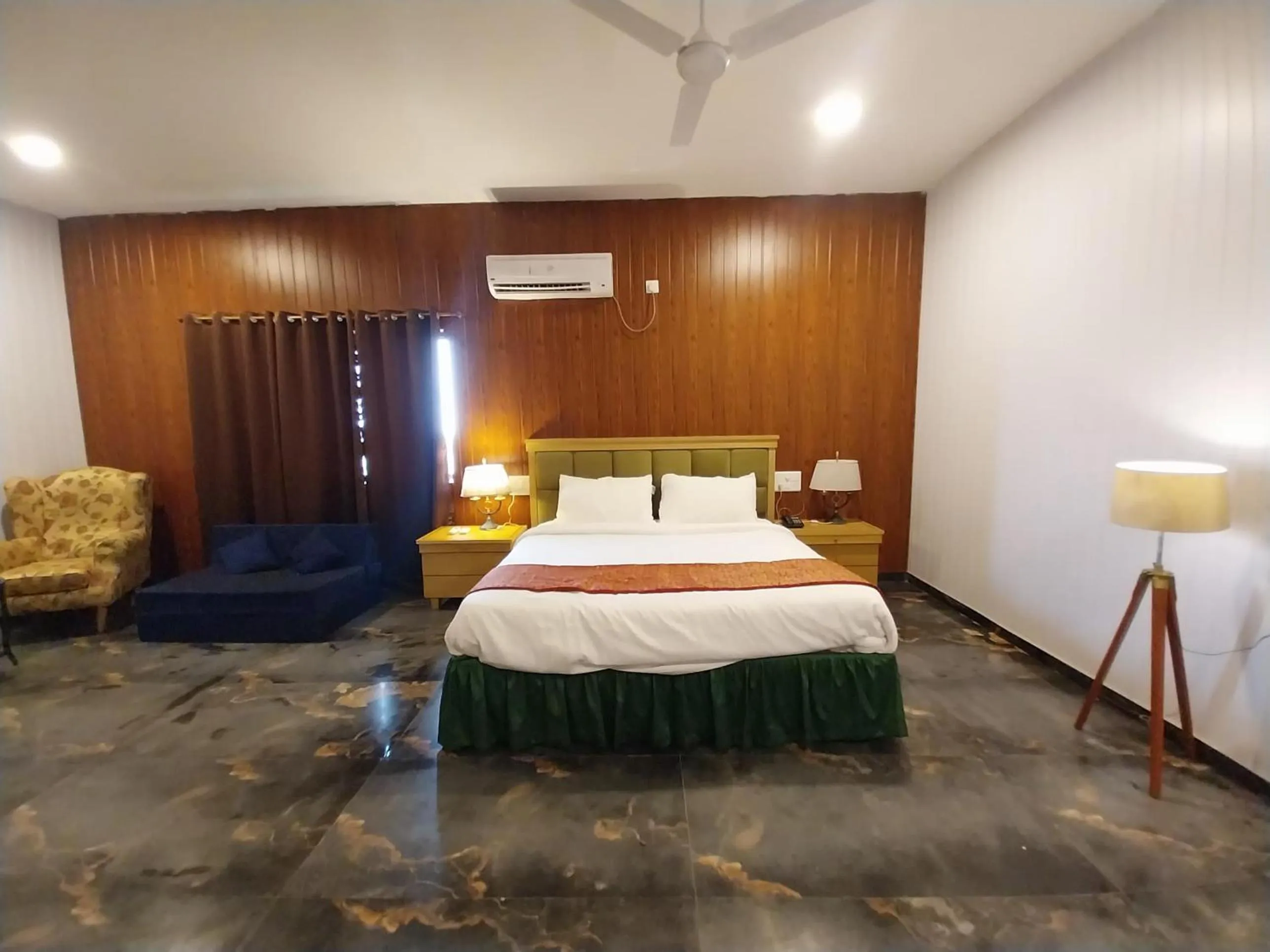 Bed in Mango Valley Resort Ganpatipule