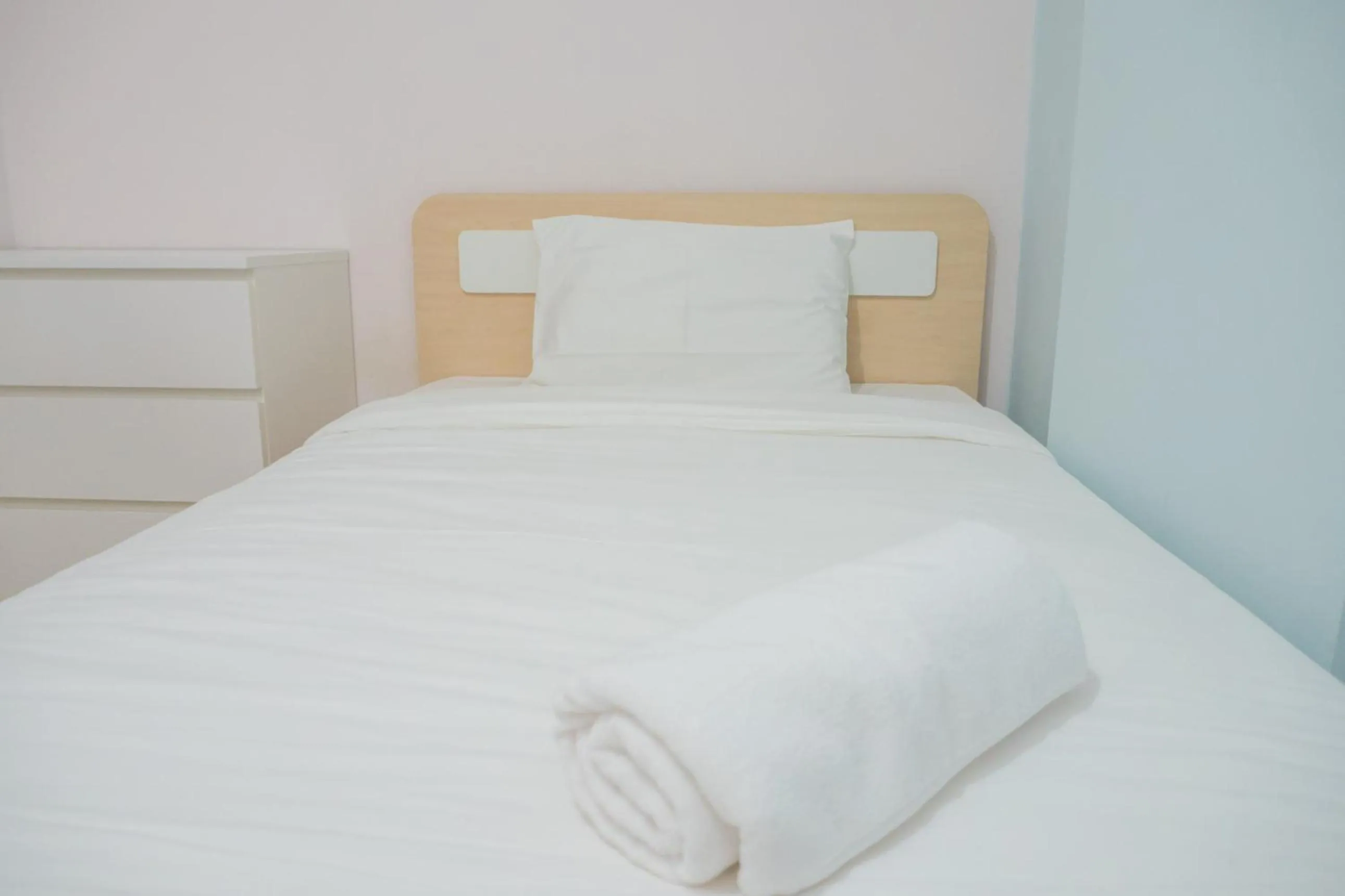 Bed in Pleasant 2BR Apartment at Gateway Pasteur By Travelio
