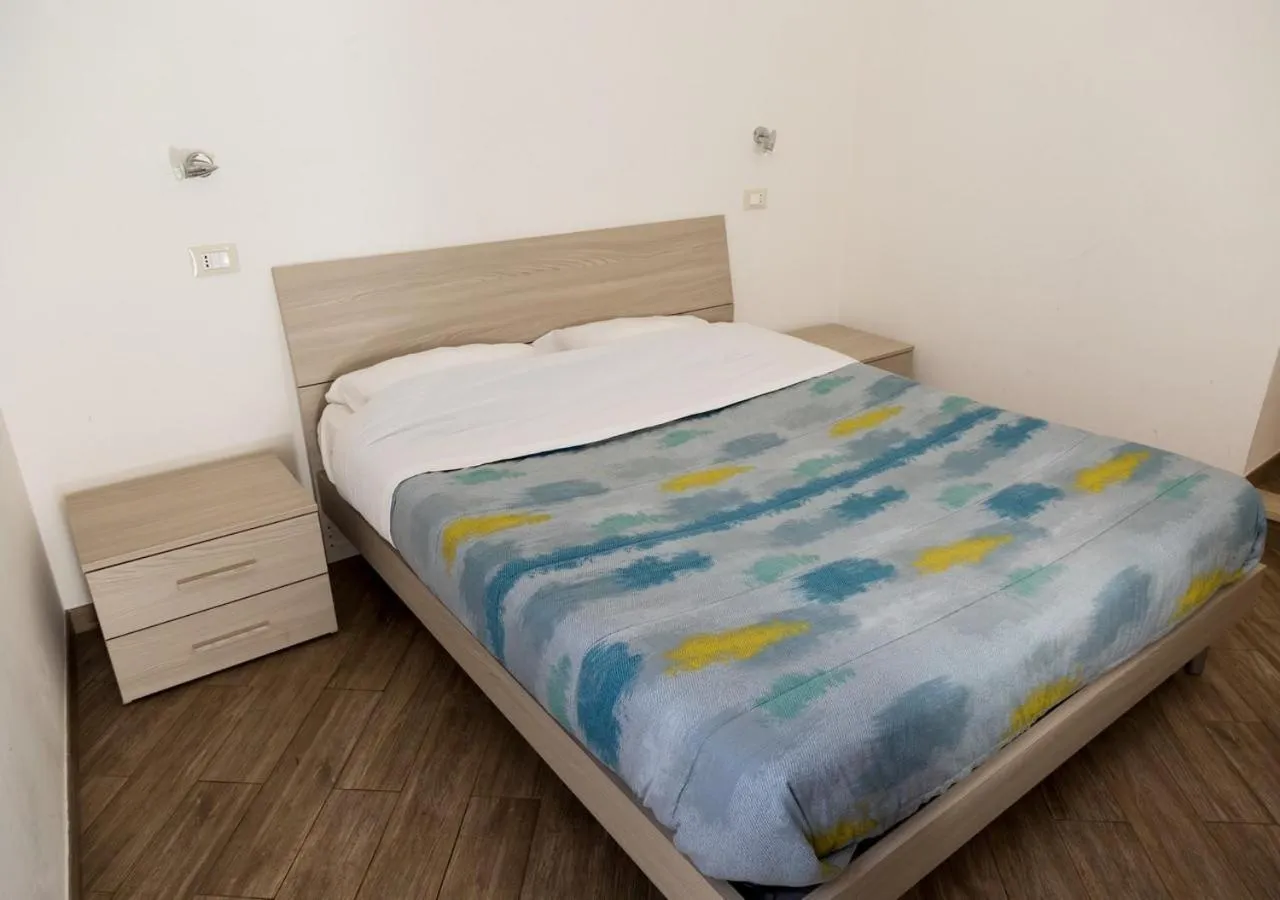 Bed in Village Inn Motel Holt