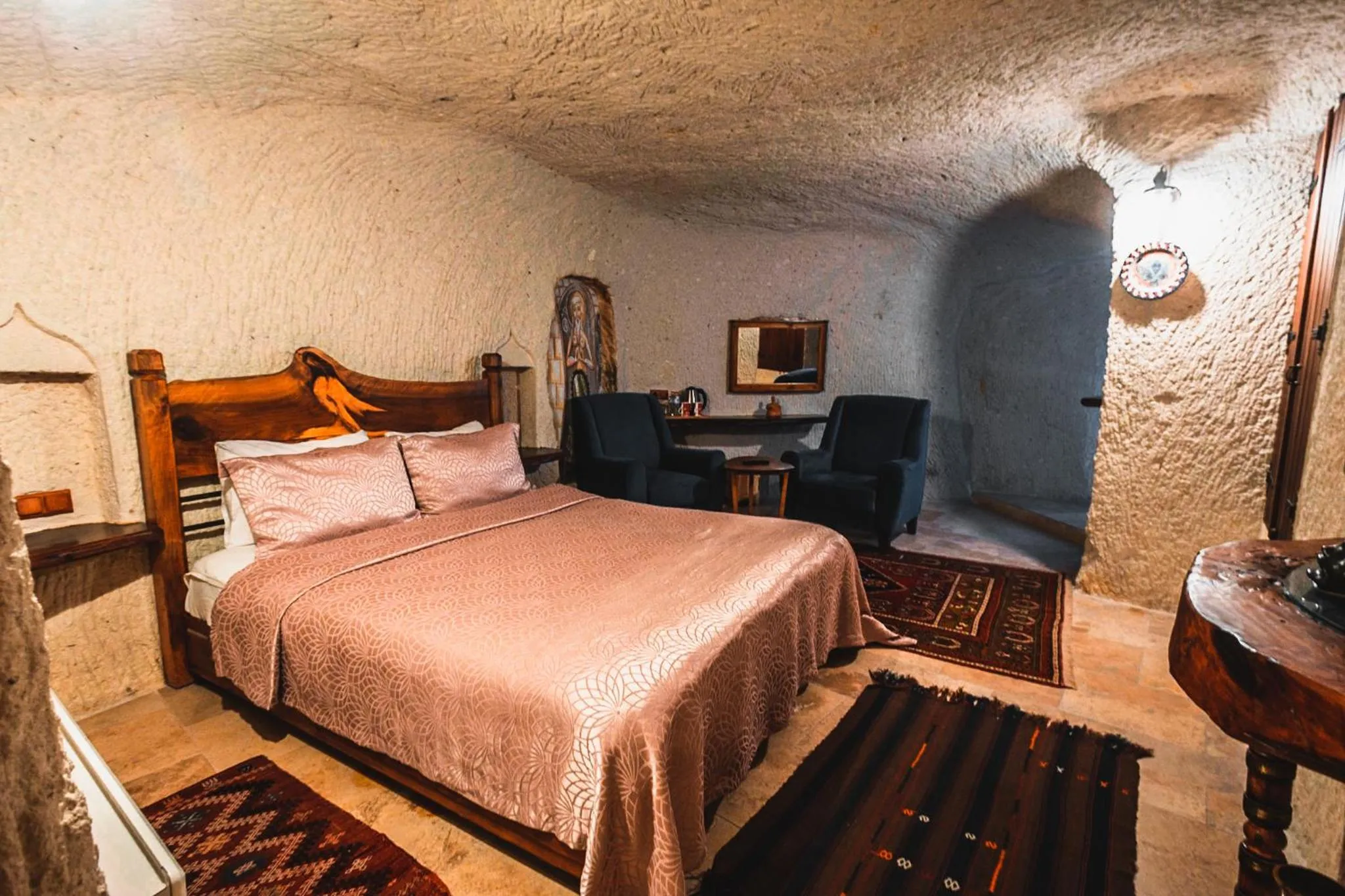 Bed in APEX CAVE HOTEL