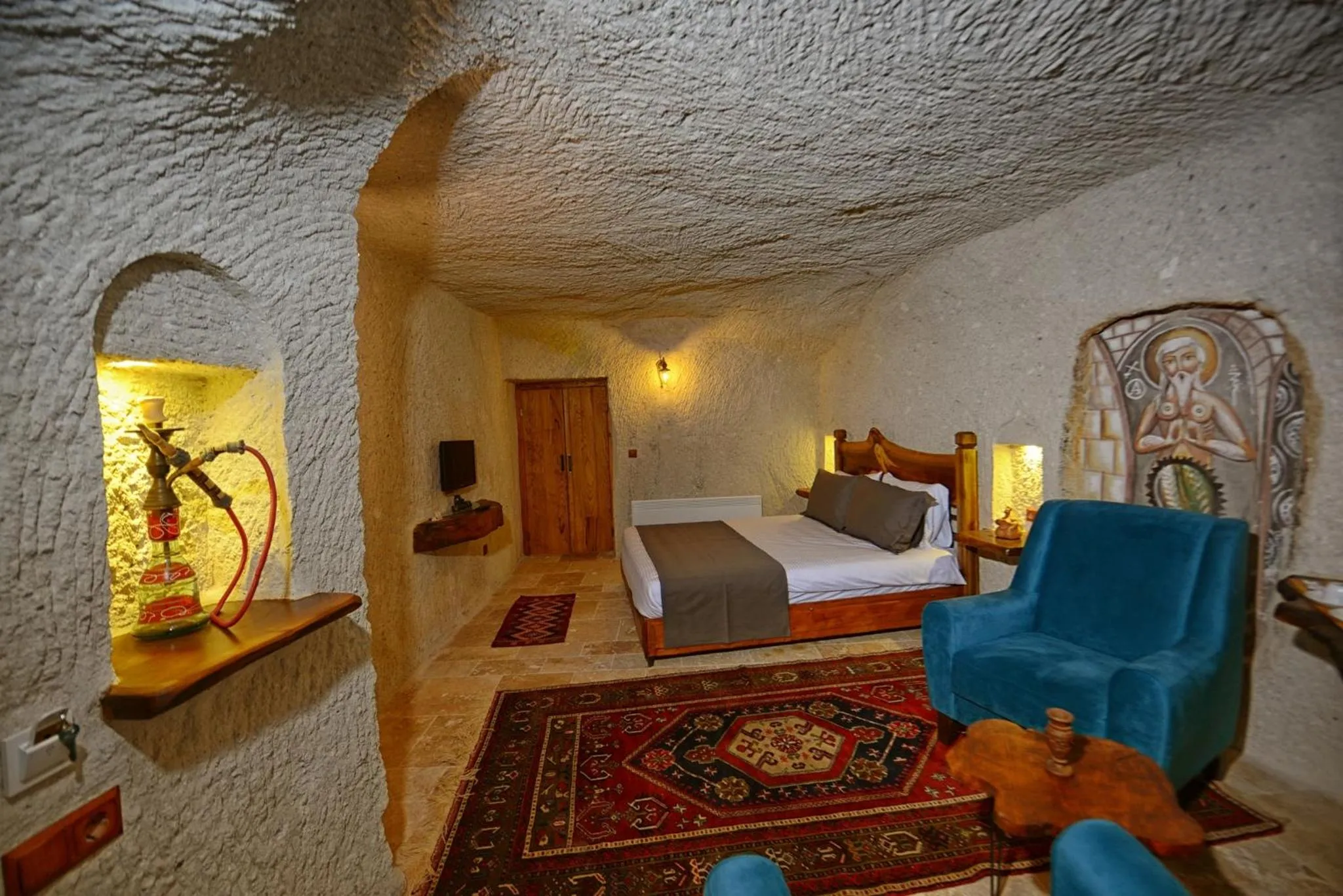 Bed in APEX CAVE HOTEL