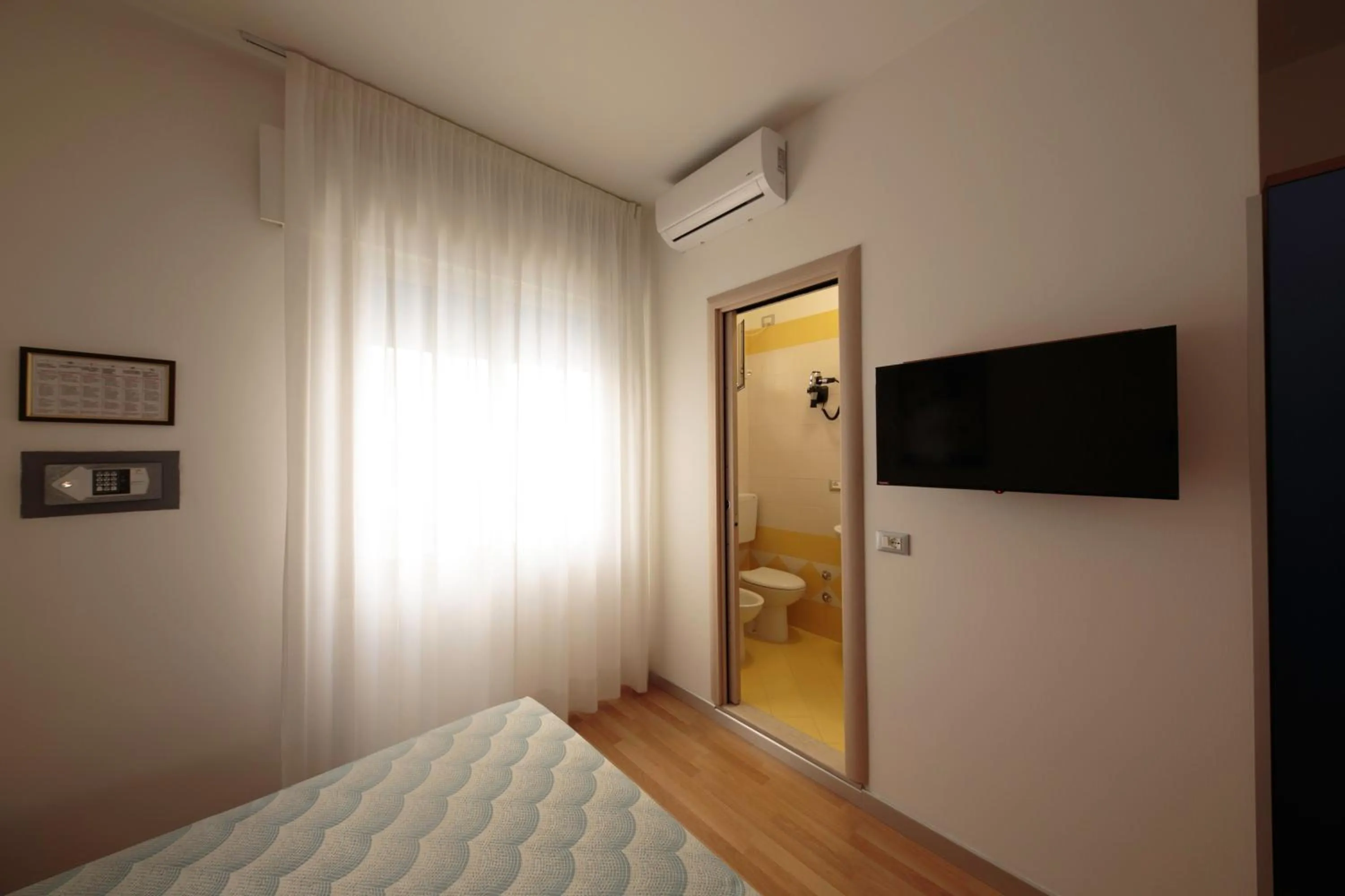 Bed in Hotel Riviera