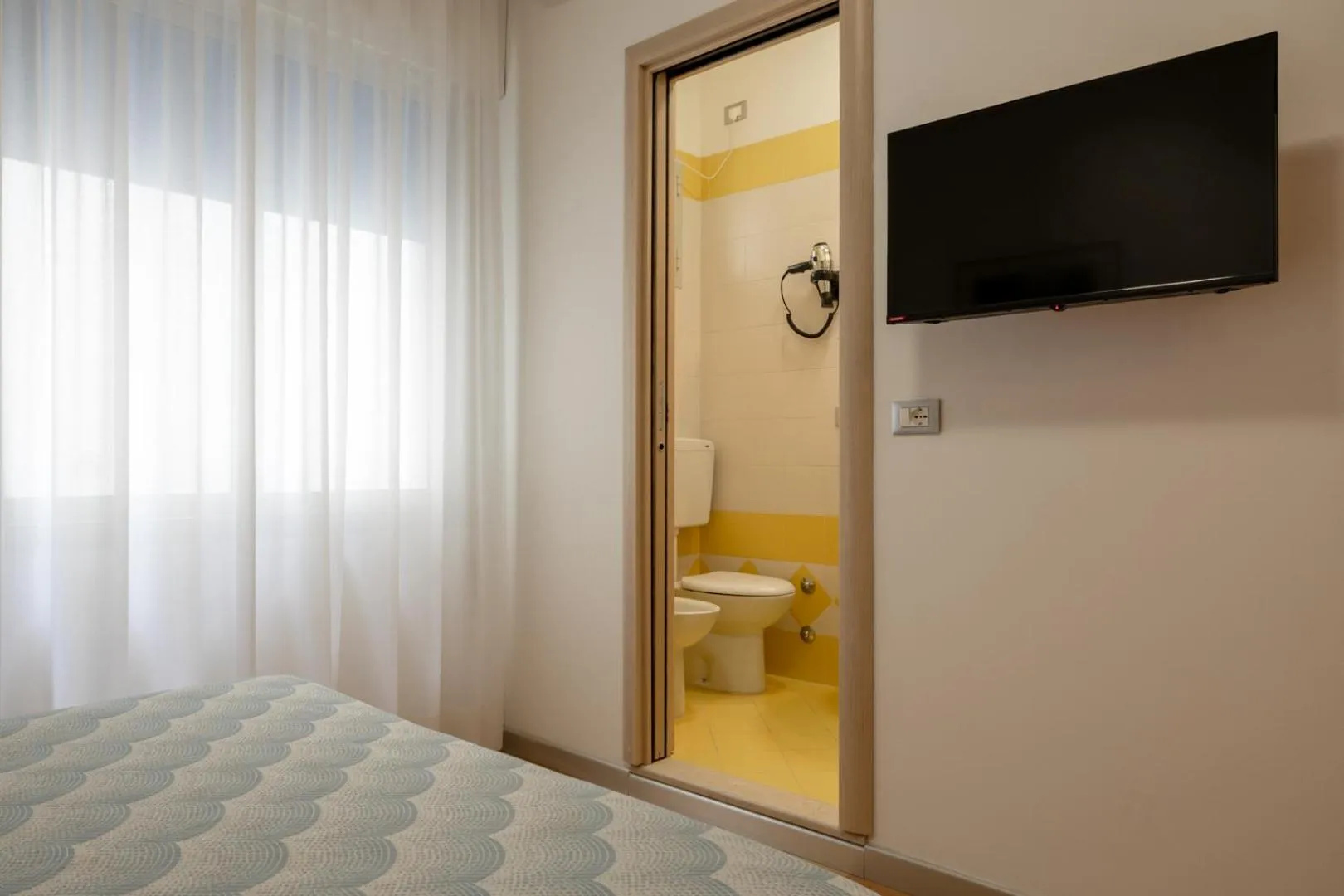 Bed in Hotel Riviera