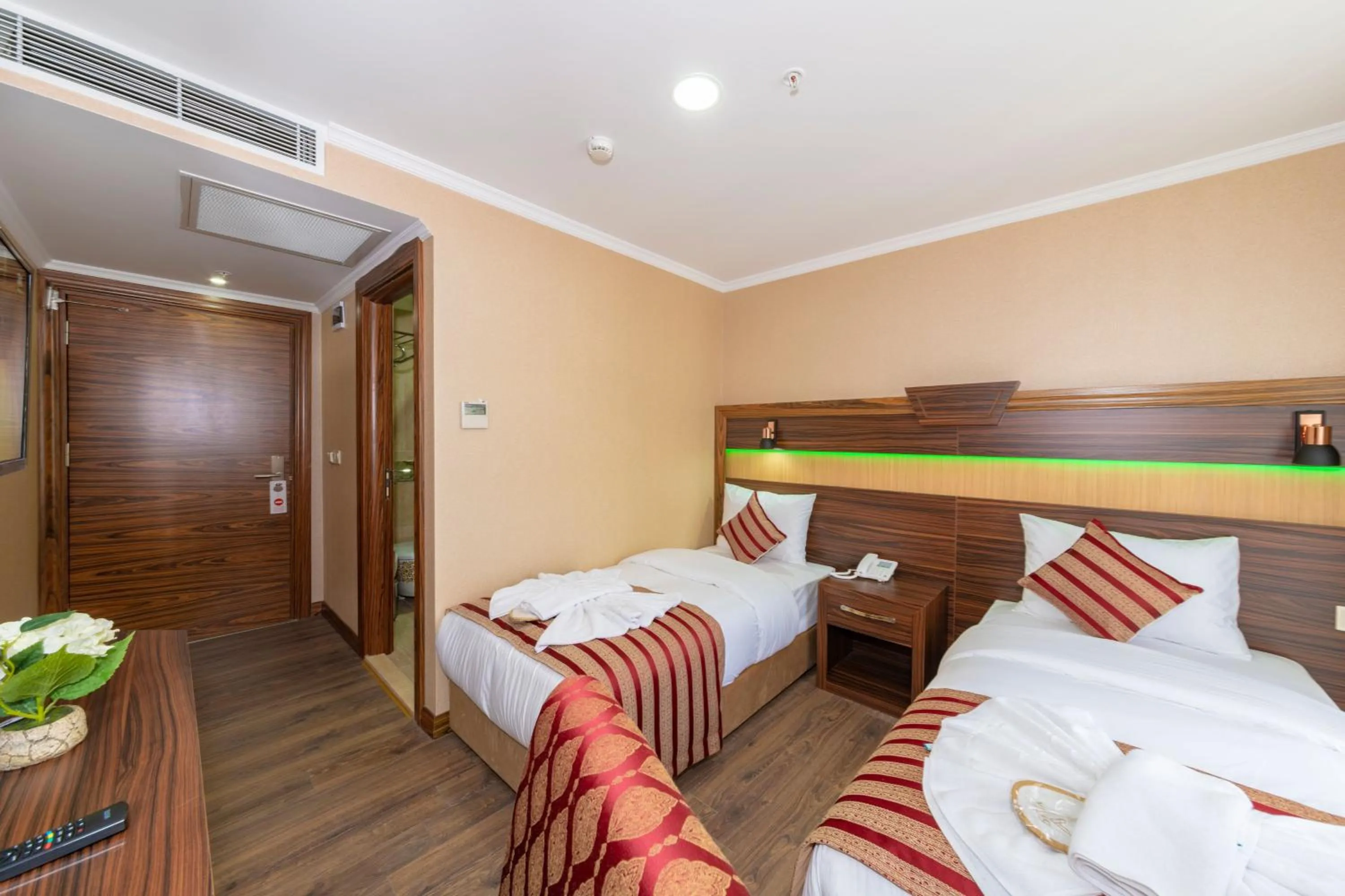 Bed in Vision Deluxe Hotel