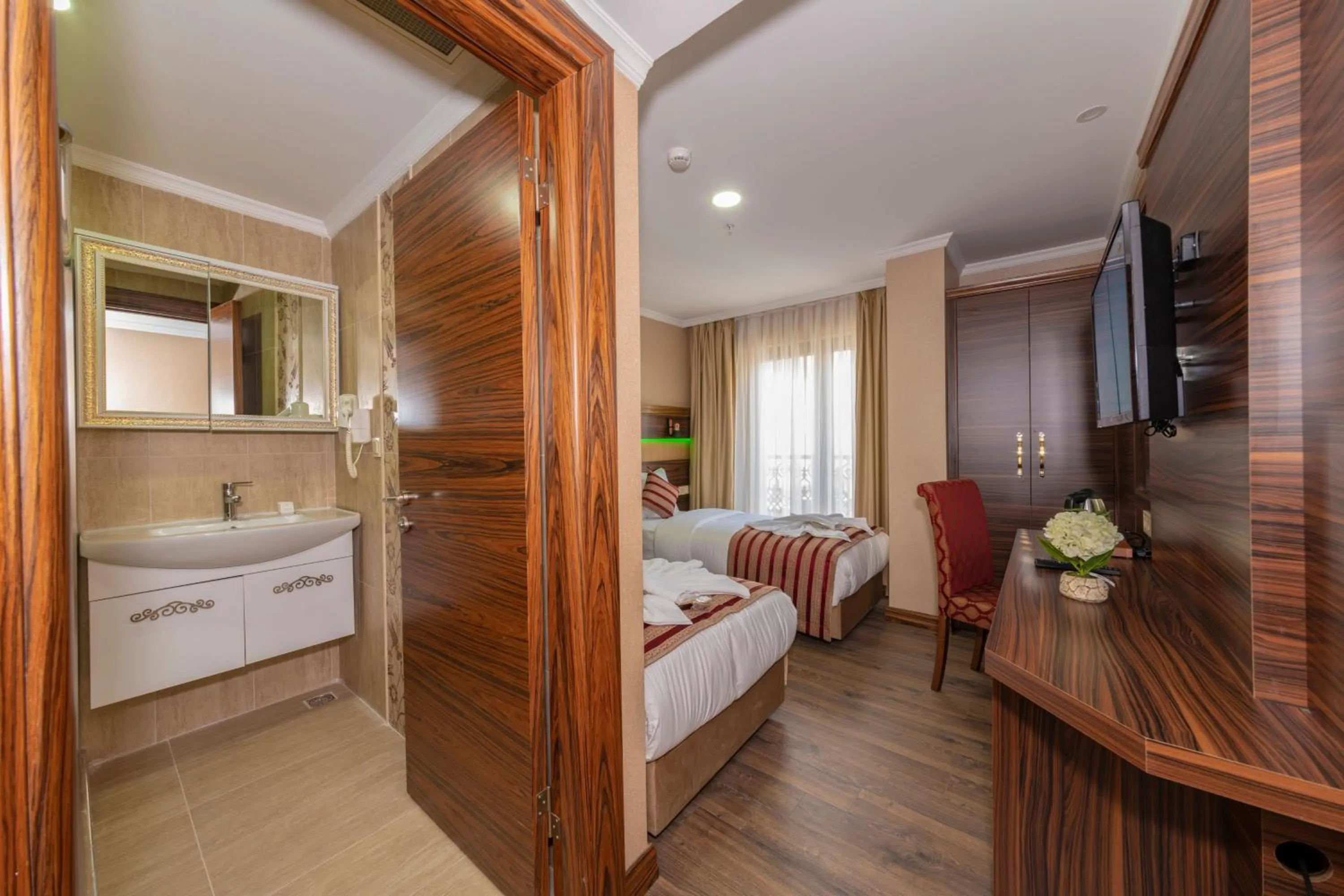 Bed in Vision Deluxe Hotel