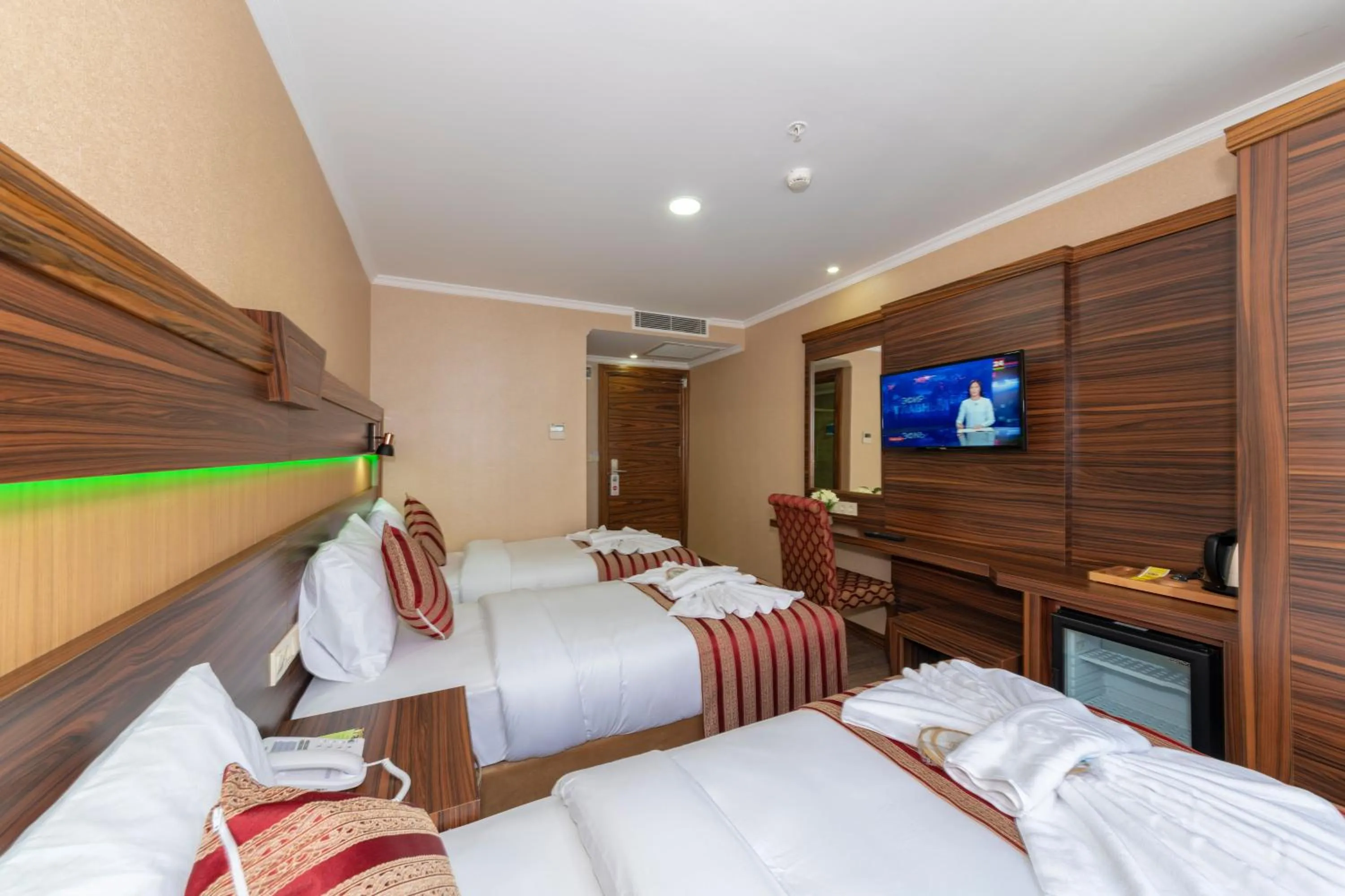 Bed in Vision Deluxe Hotel