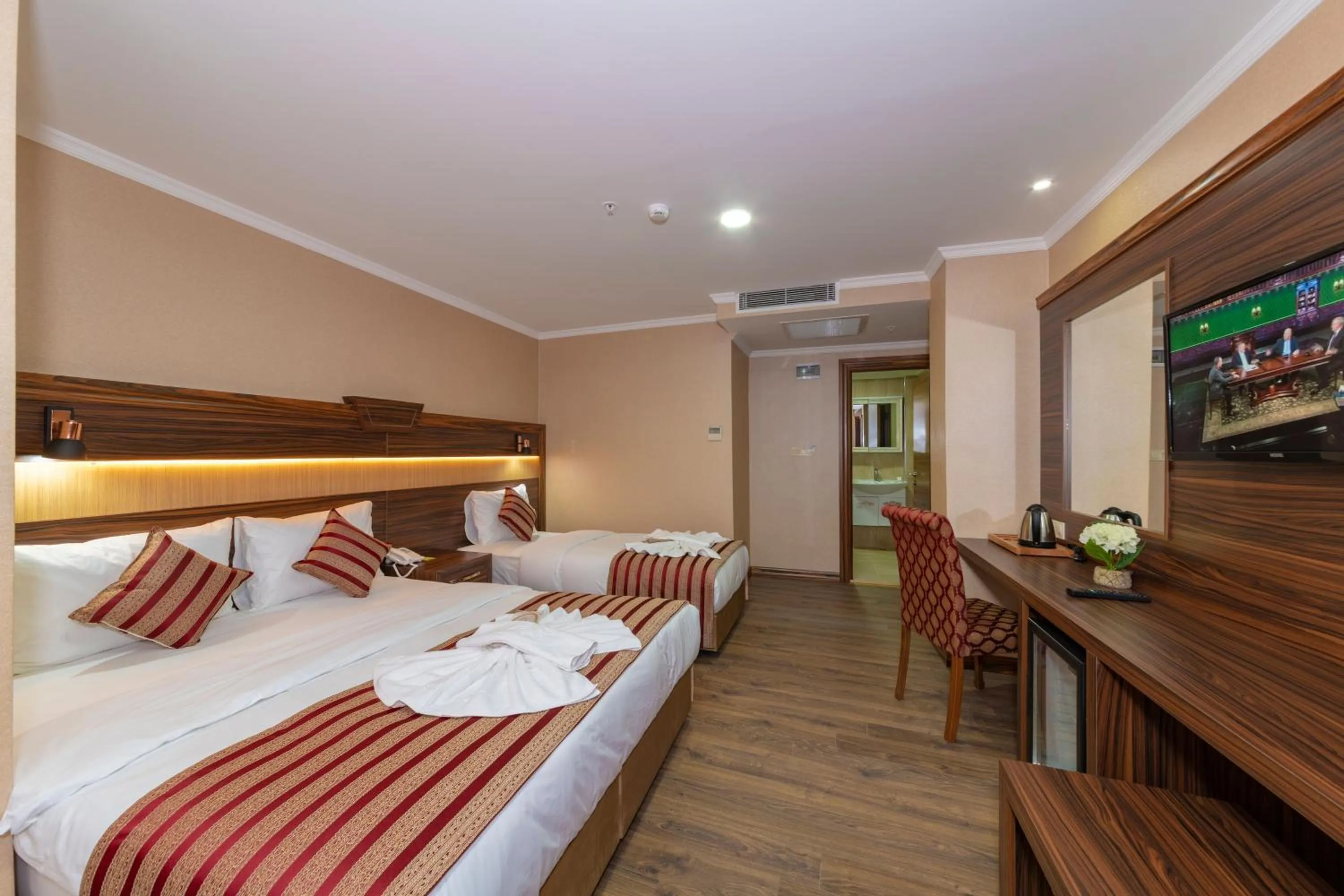 Bed in Vision Deluxe Hotel