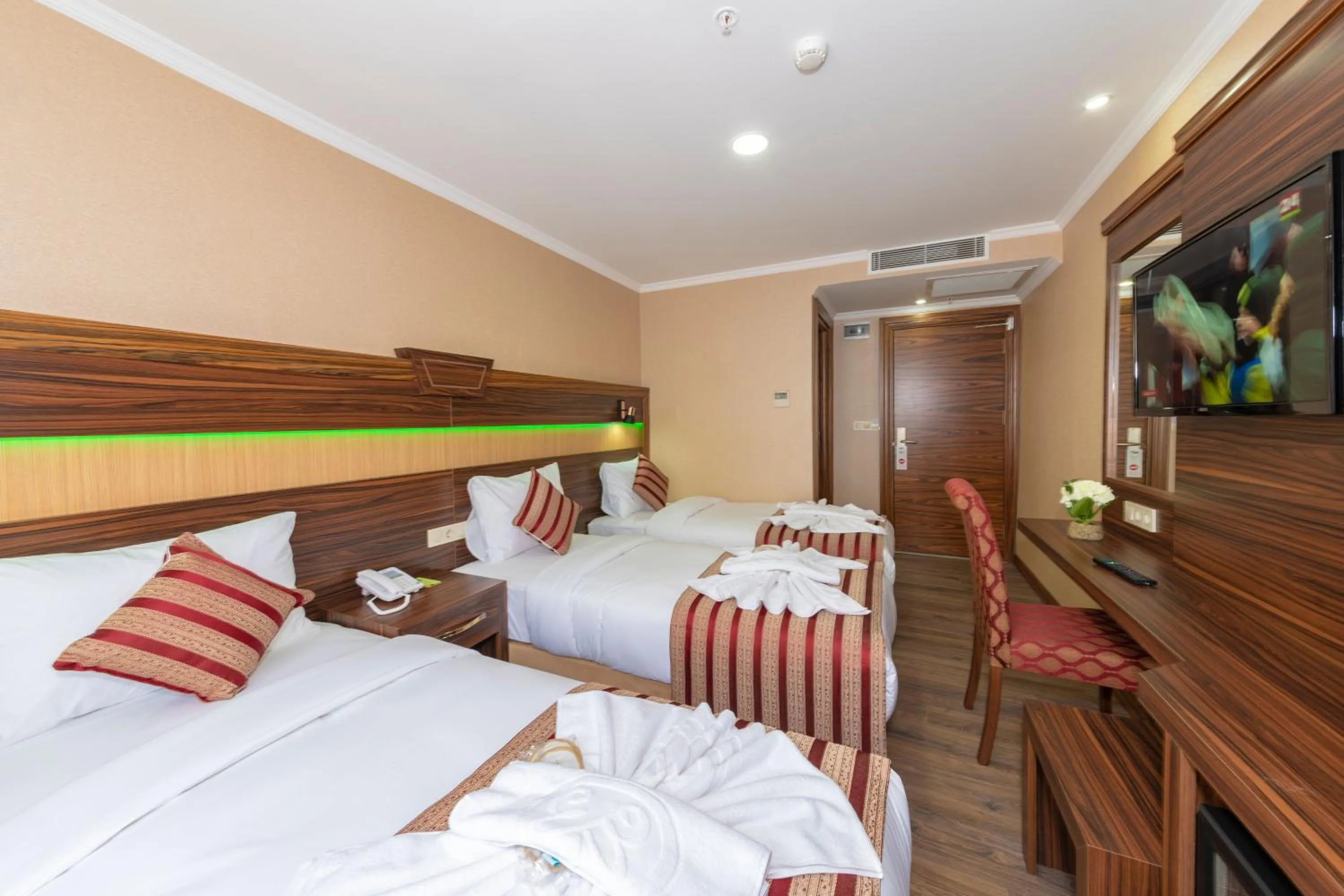 Bed in Vision Deluxe Hotel