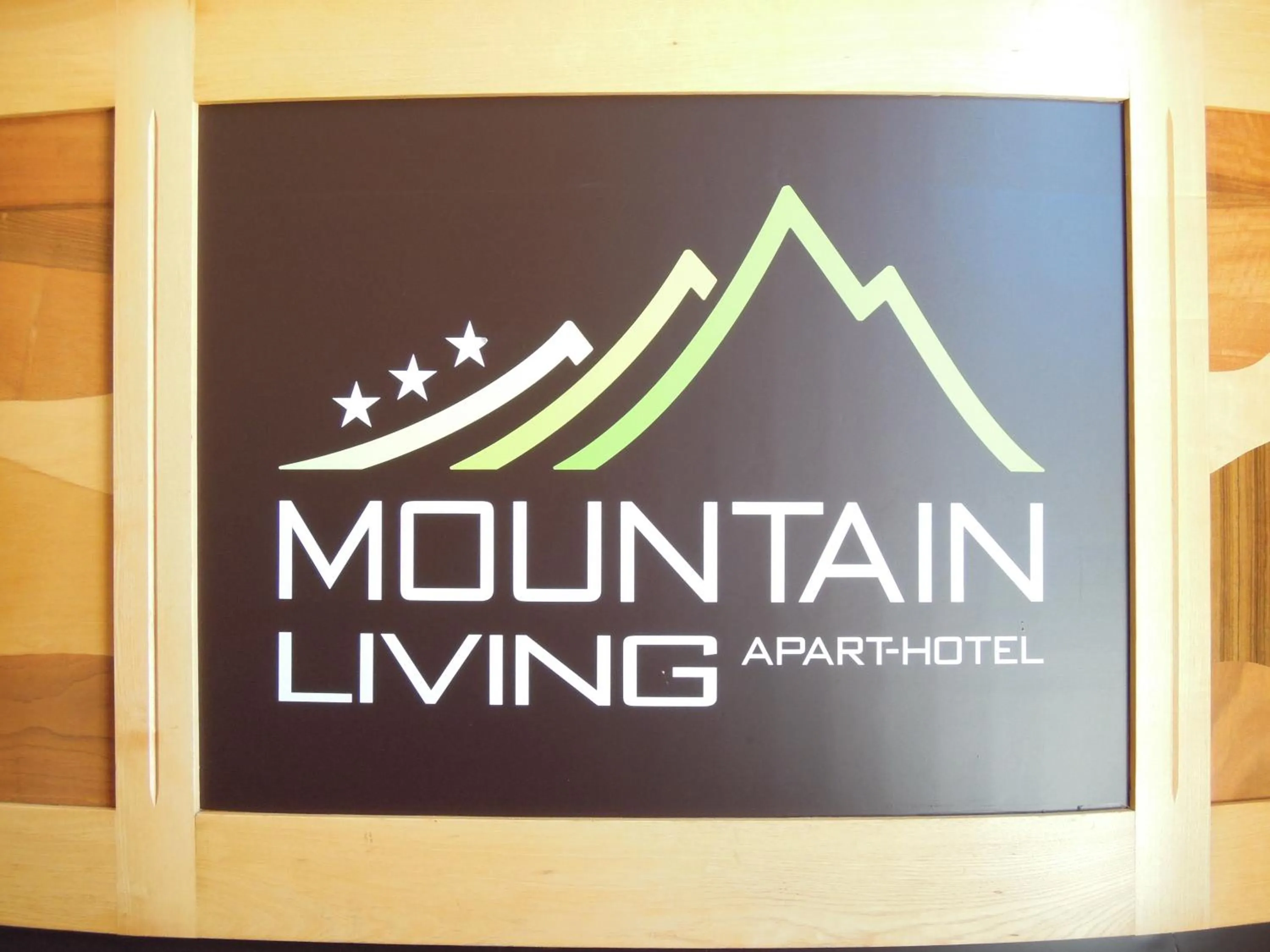 Property logo or sign in Mountain Living Apartments
