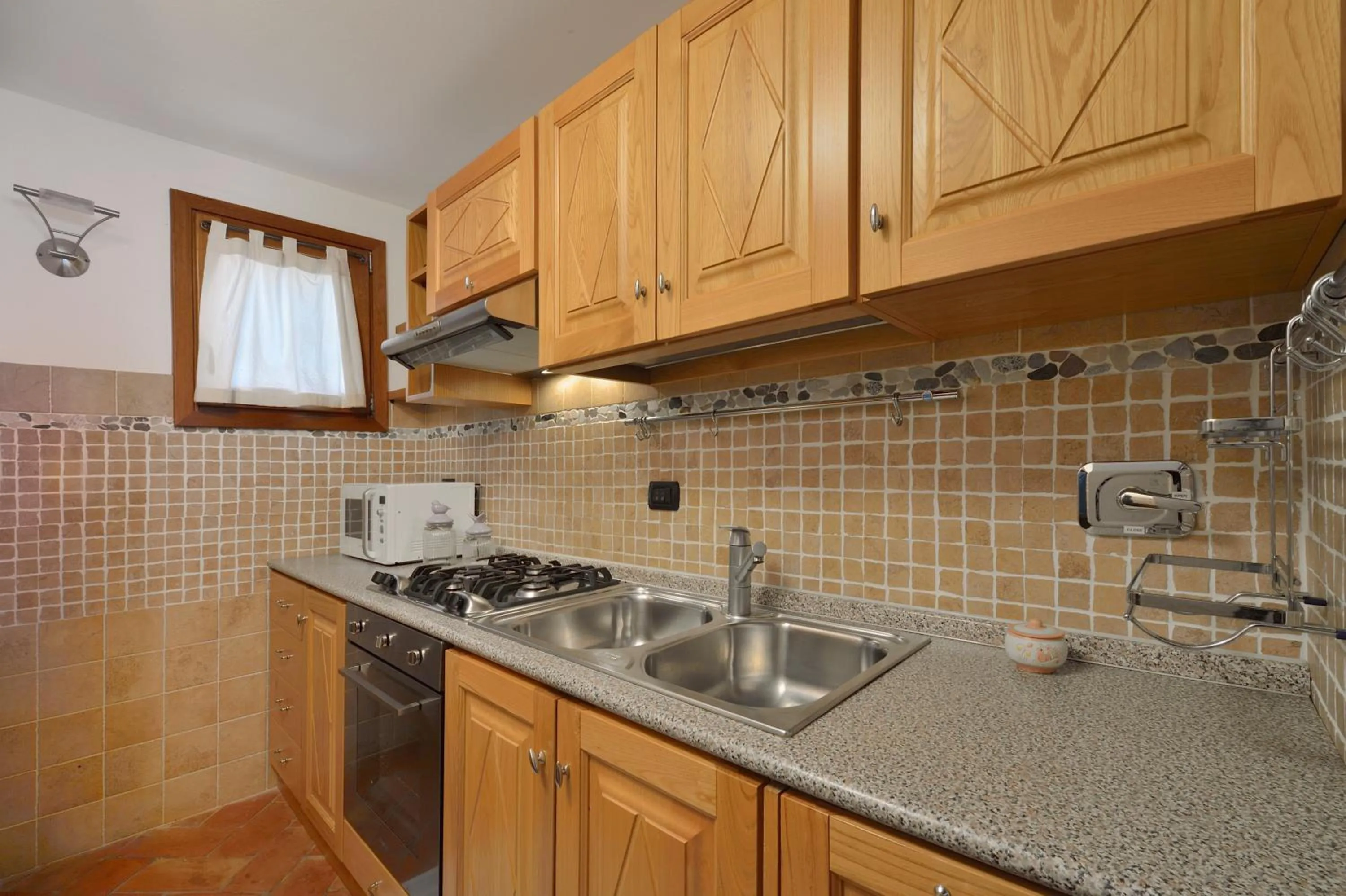 Kitchen or kitchenette in Villa Isuledda Beach