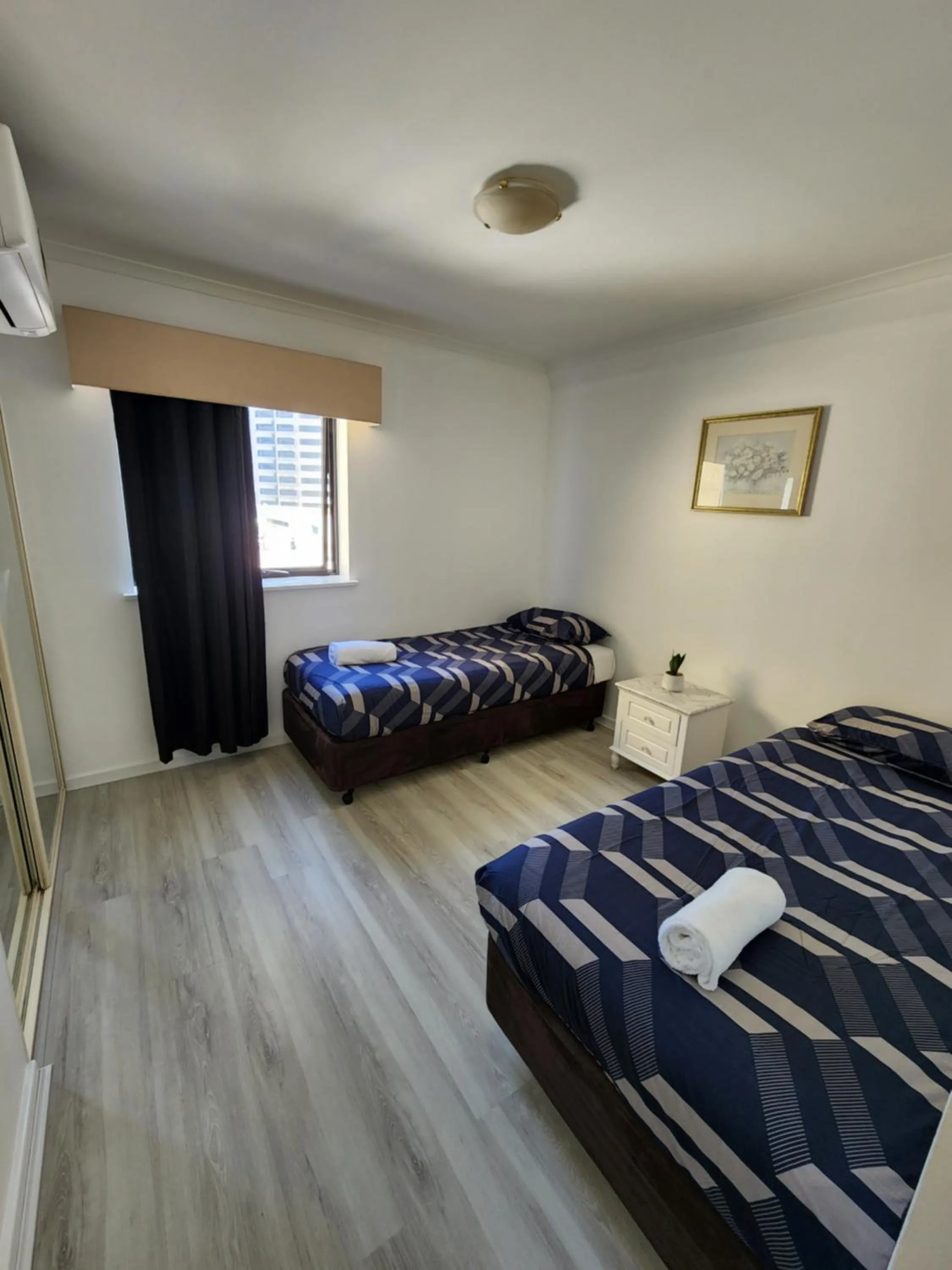 Bed in PERTH CBD APARTMENTS