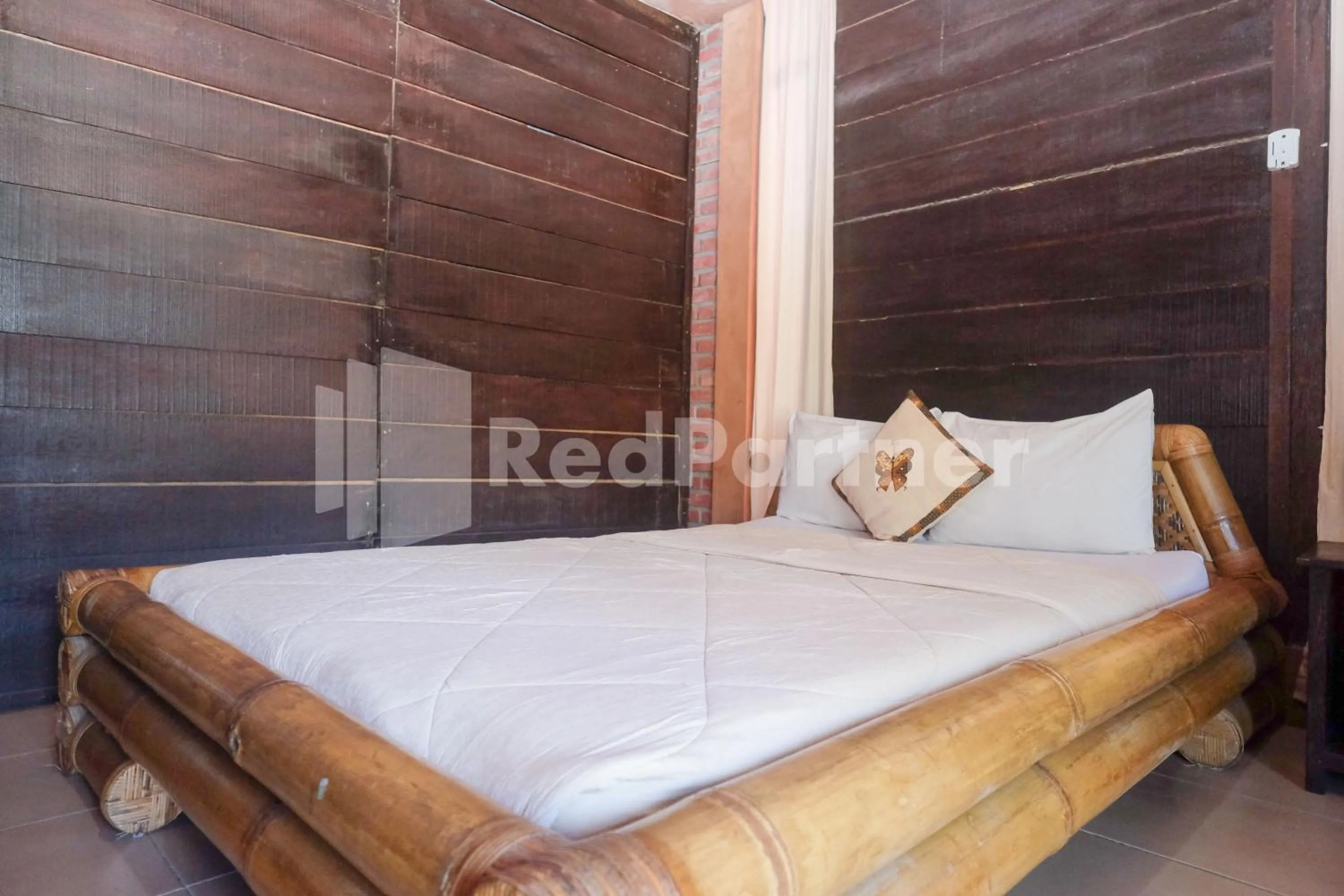 Bed in Kebon Krapyak Cottage Syariah Mitra RedDoorz near Stadion Maguwoharjo
