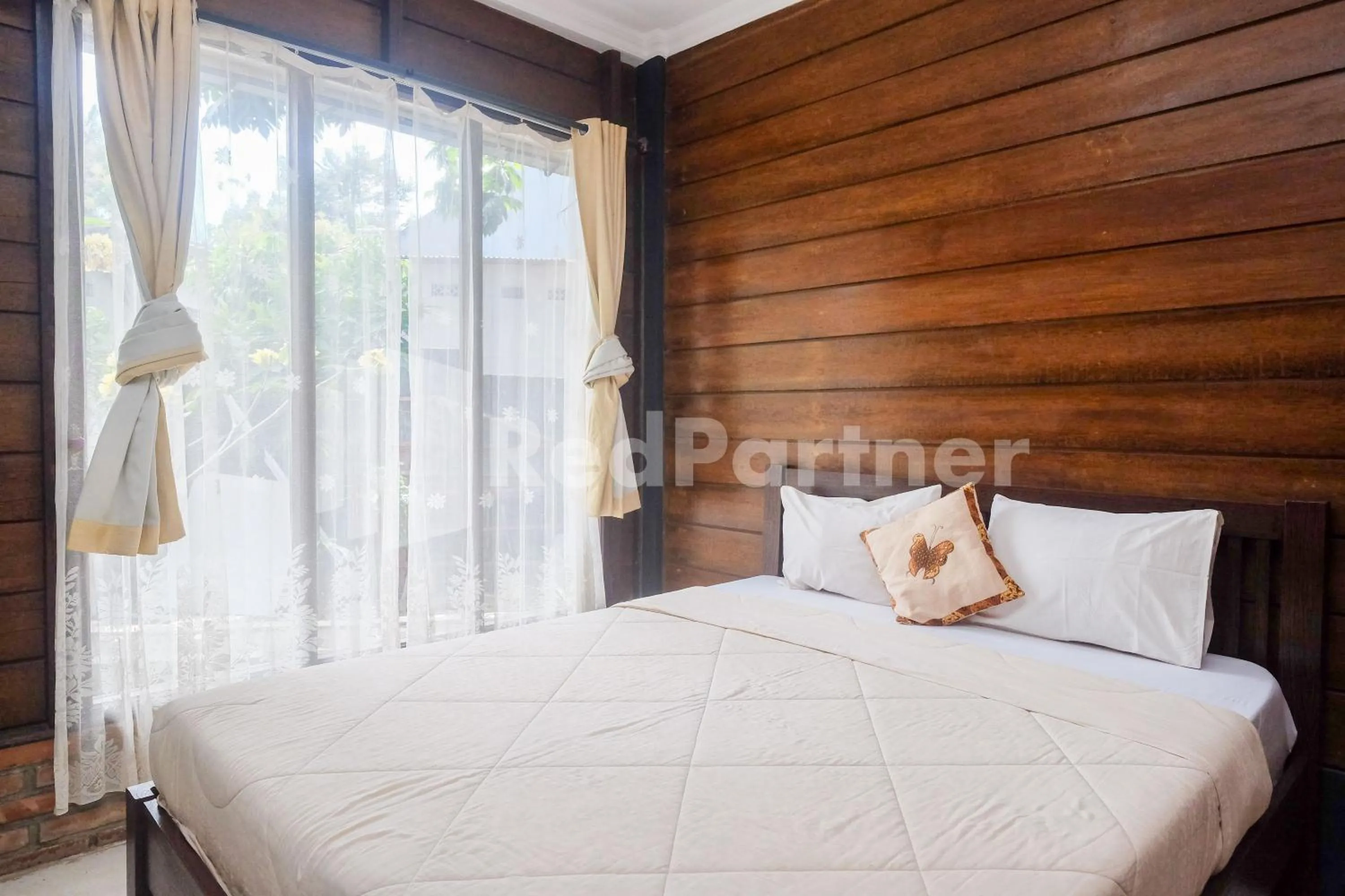 Bed in Kebon Krapyak Cottage Syariah Mitra RedDoorz near Stadion Maguwoharjo