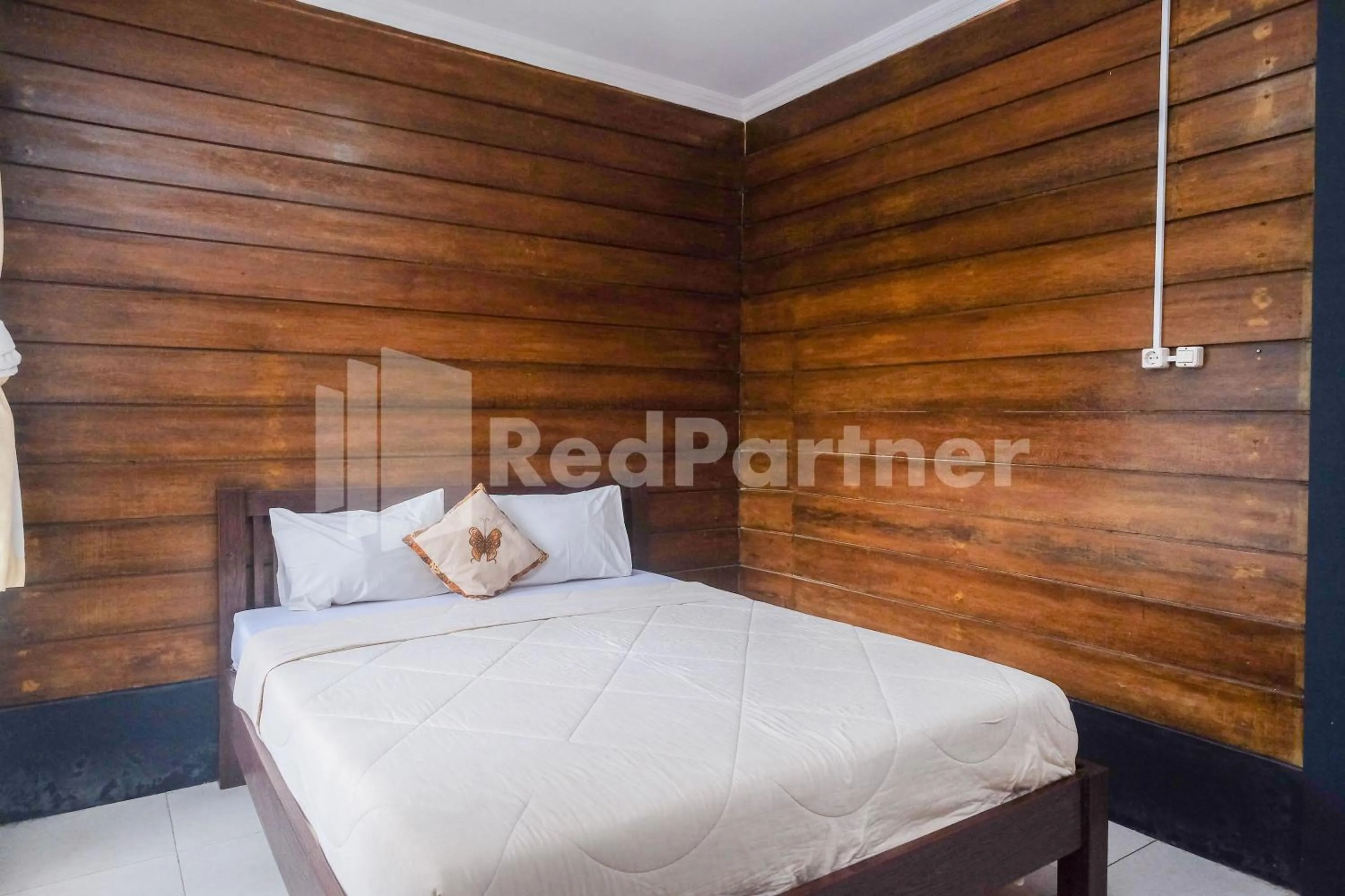 Bed in Kebon Krapyak Cottage Syariah Mitra RedDoorz near Stadion Maguwoharjo