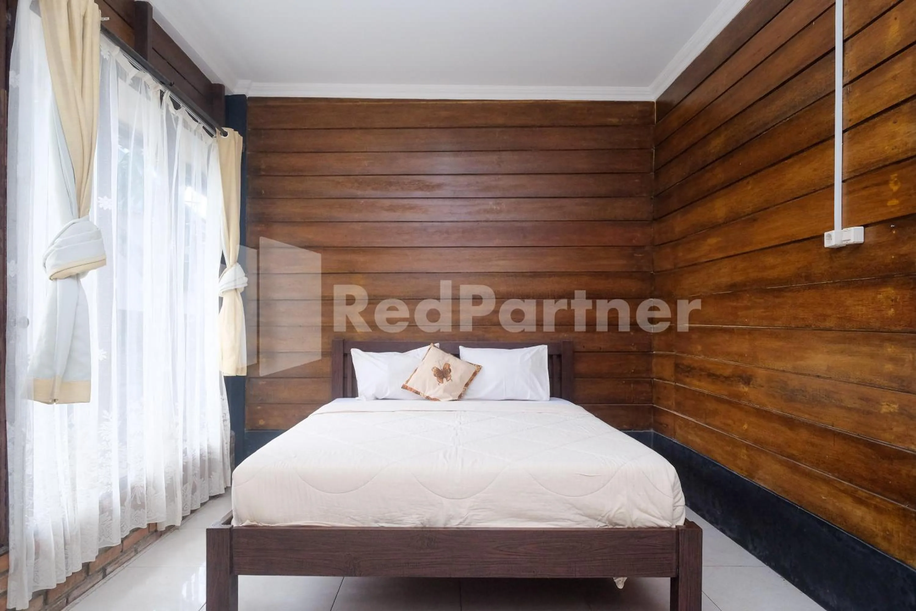 Bed in Kebon Krapyak Cottage Syariah Mitra RedDoorz near Stadion Maguwoharjo