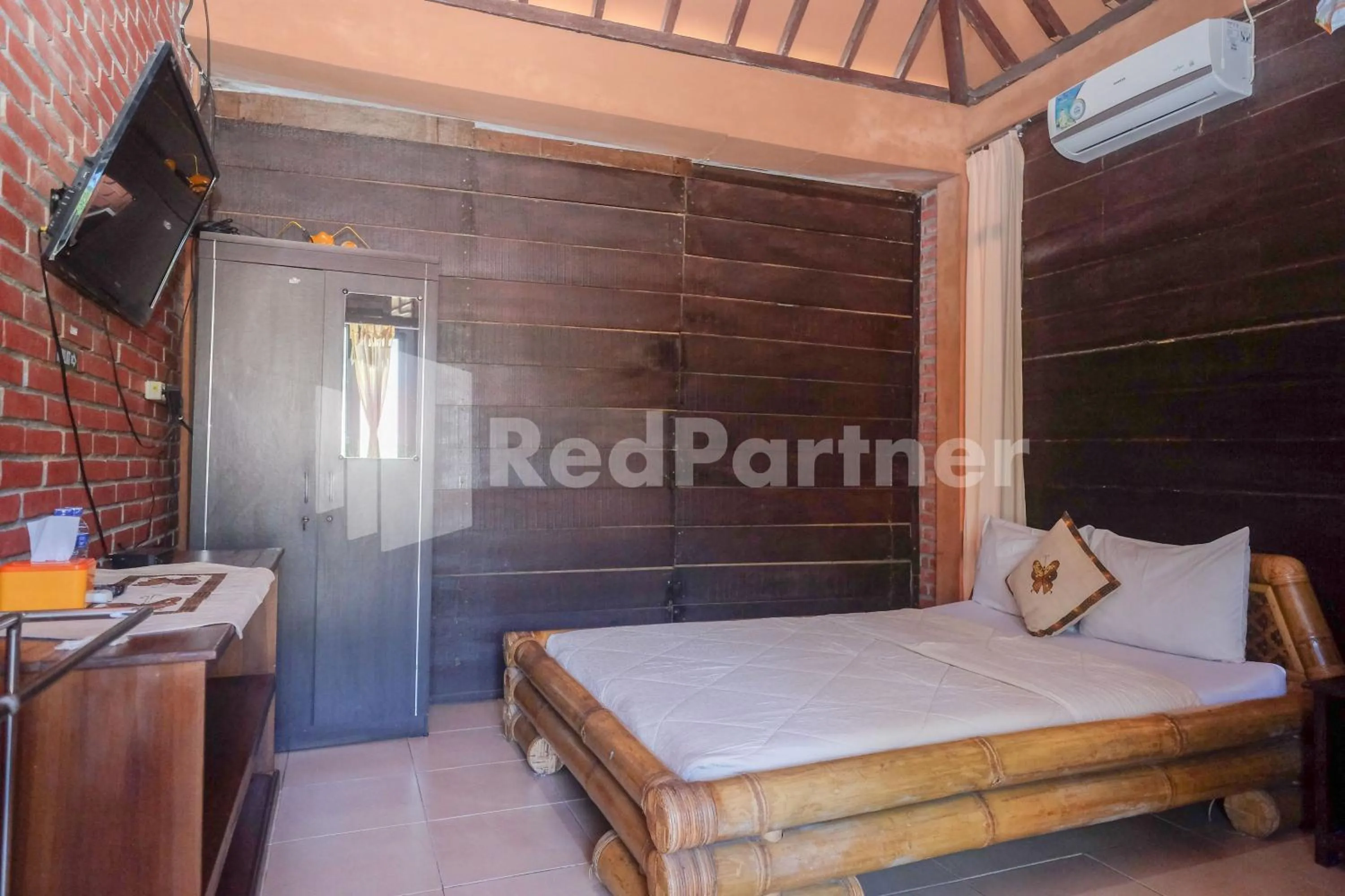 Bed in Kebon Krapyak Cottage Syariah Mitra RedDoorz near Stadion Maguwoharjo