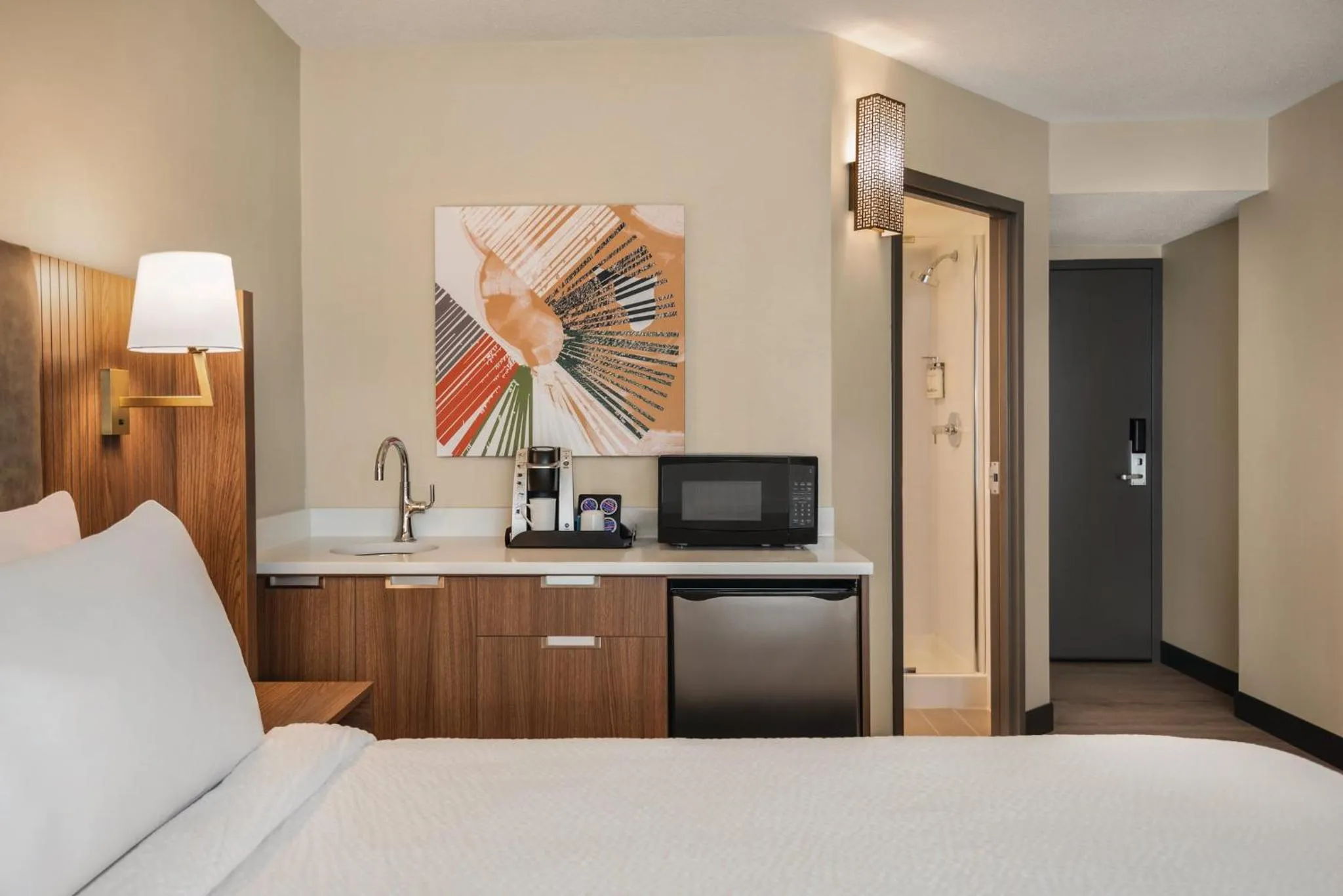 Kitchen or kitchenette, Bed in Holiday Inn & Suites Vancouver Downtown by IHG