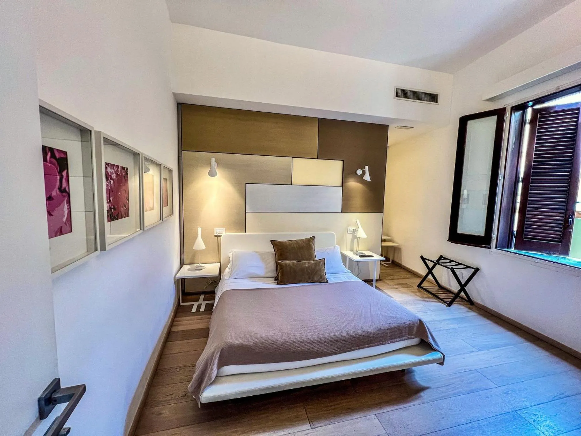 Bed in Santacroce Luxury Rooms