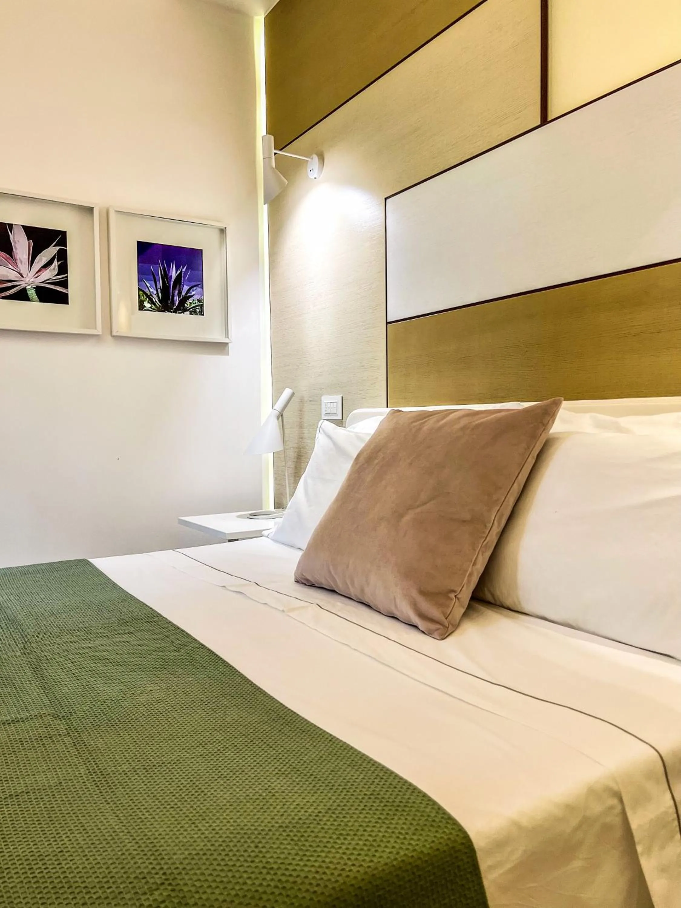 Bed in Santacroce Luxury Rooms