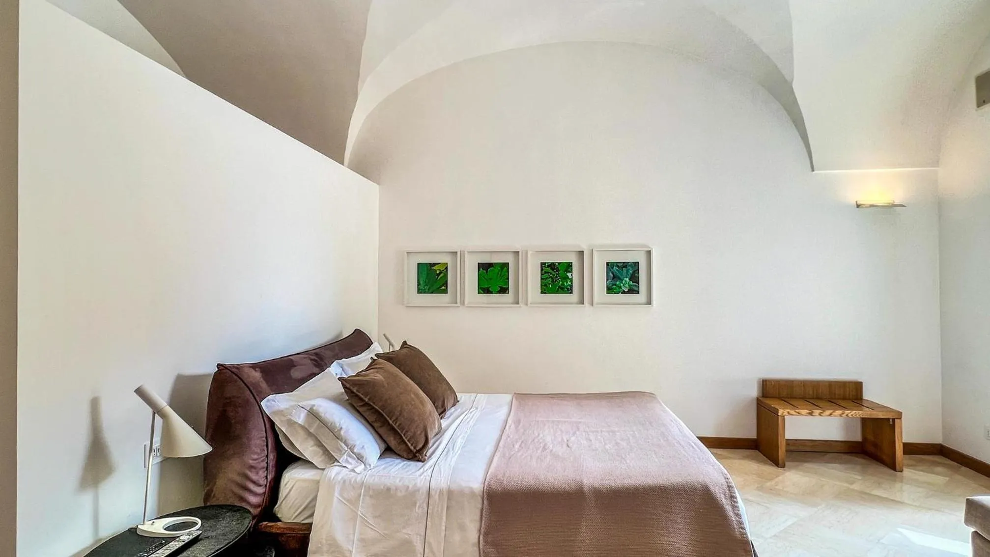 Bed in Santacroce Luxury Rooms