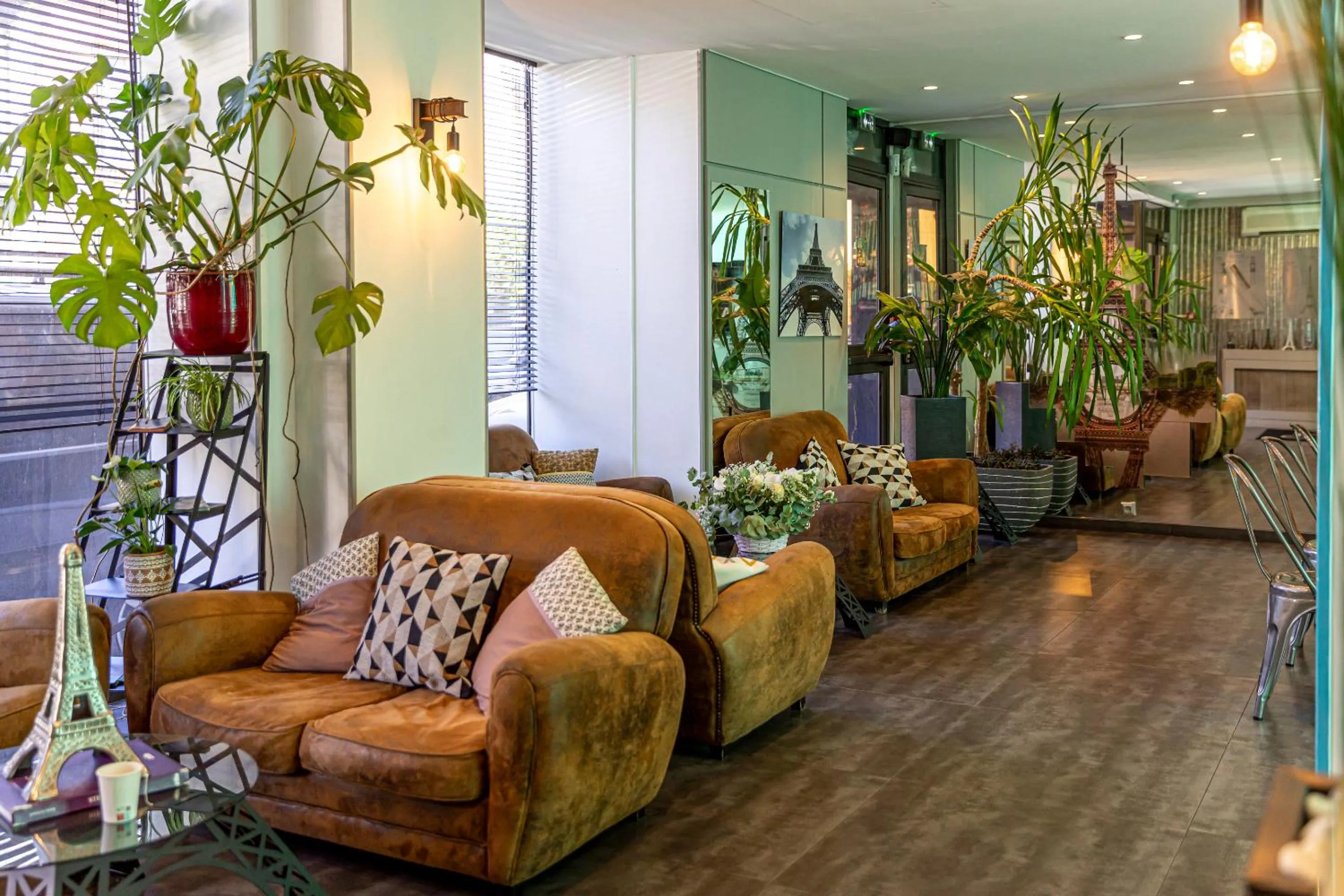 Communal lounge/ TV room in Hotel Alpha Paris Eiffel by Patrick Hayat