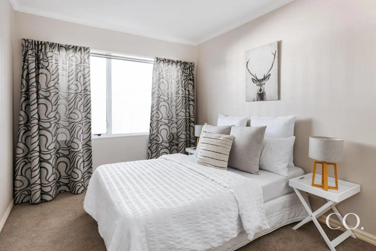 Bed in Pavilion Beachfront Apartments