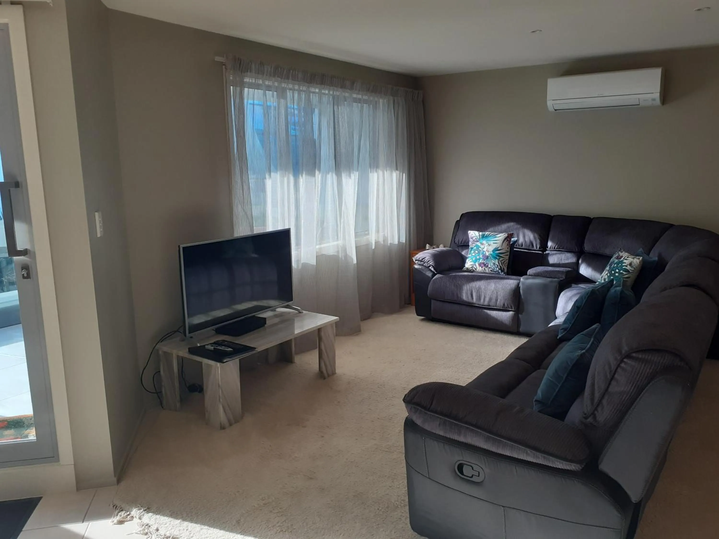 Living room in Pavilion Beachfront Apartments