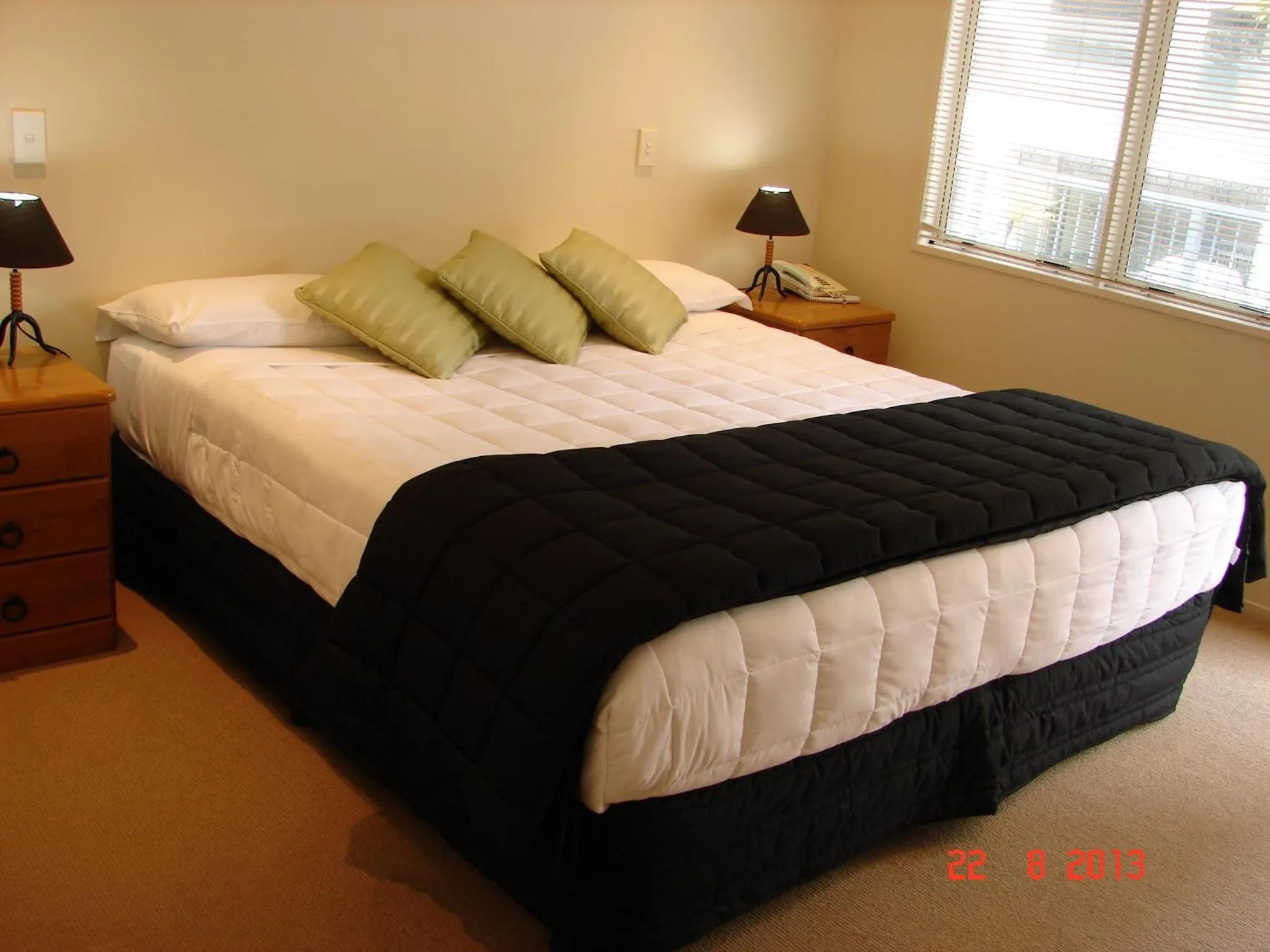 Bed in Pavilion Beachfront Apartments