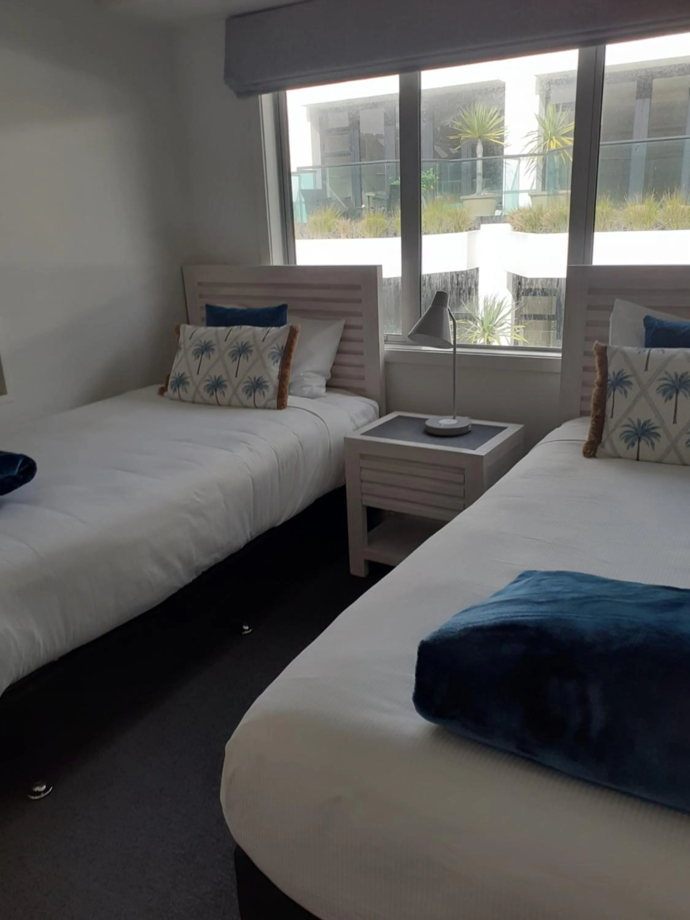 Bed in Pavilion Beachfront Apartments