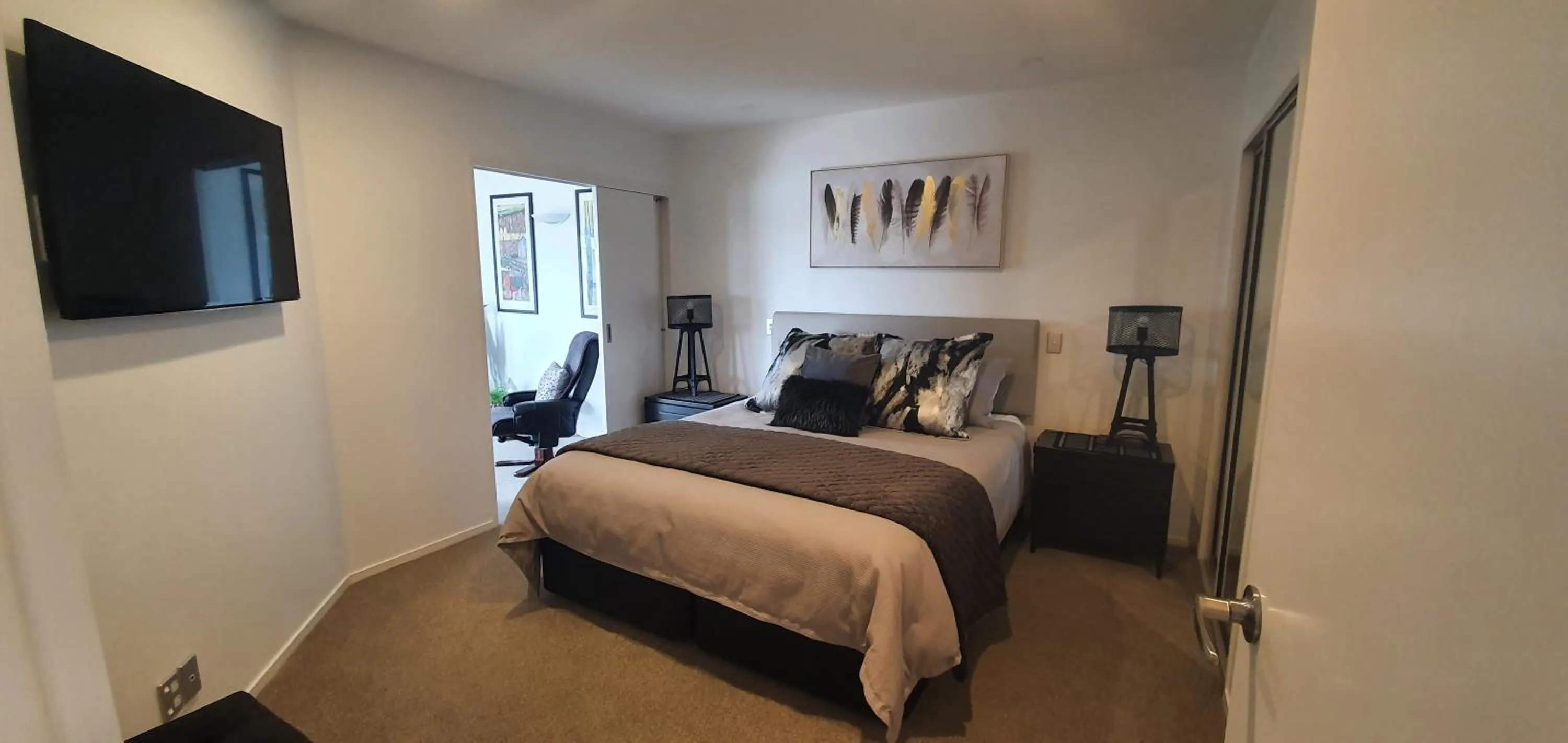 Bed in Pavilion Beachfront Apartments