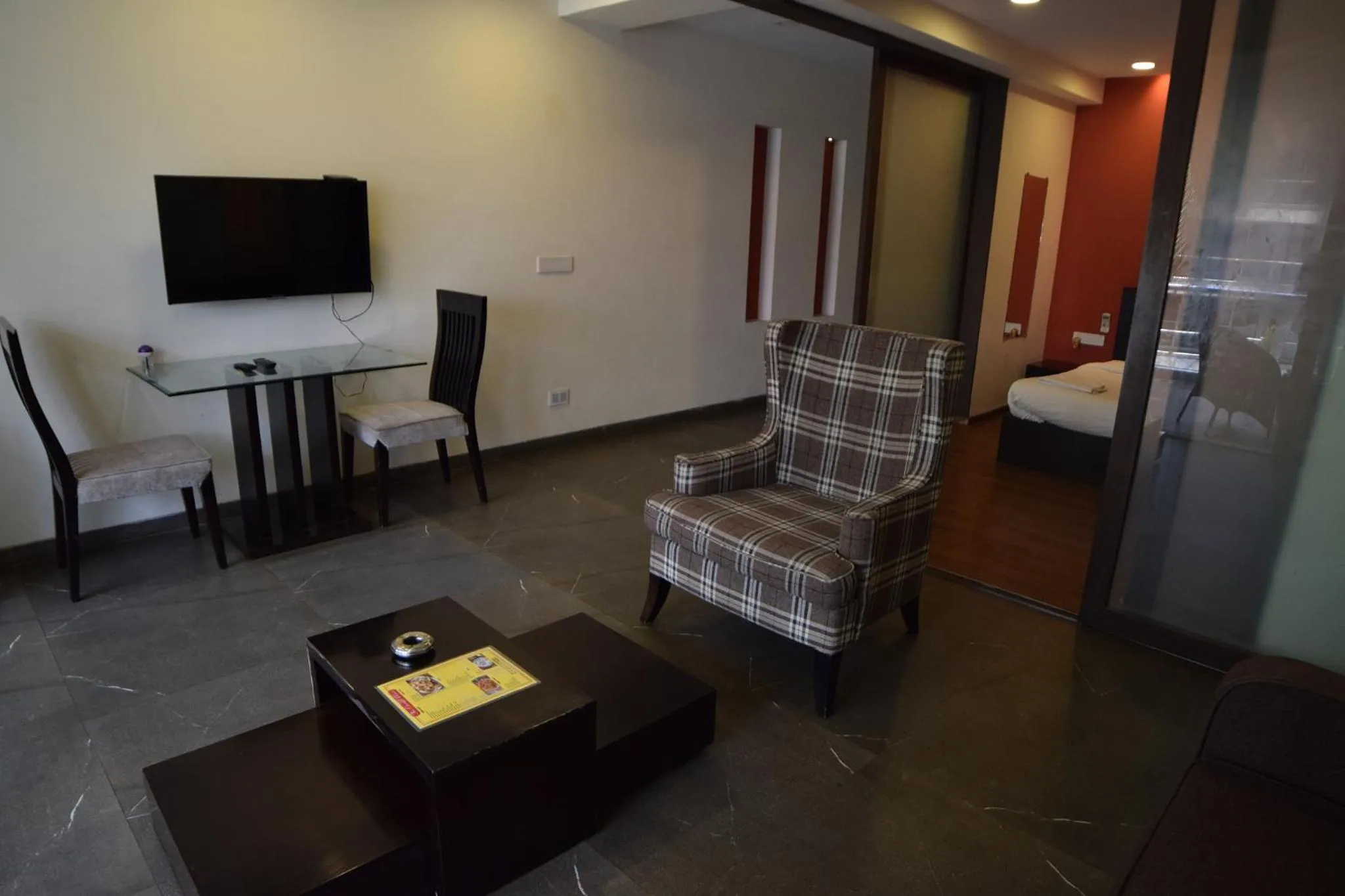 Seating area, Bed in The Eternal Wave by Krish Retreat