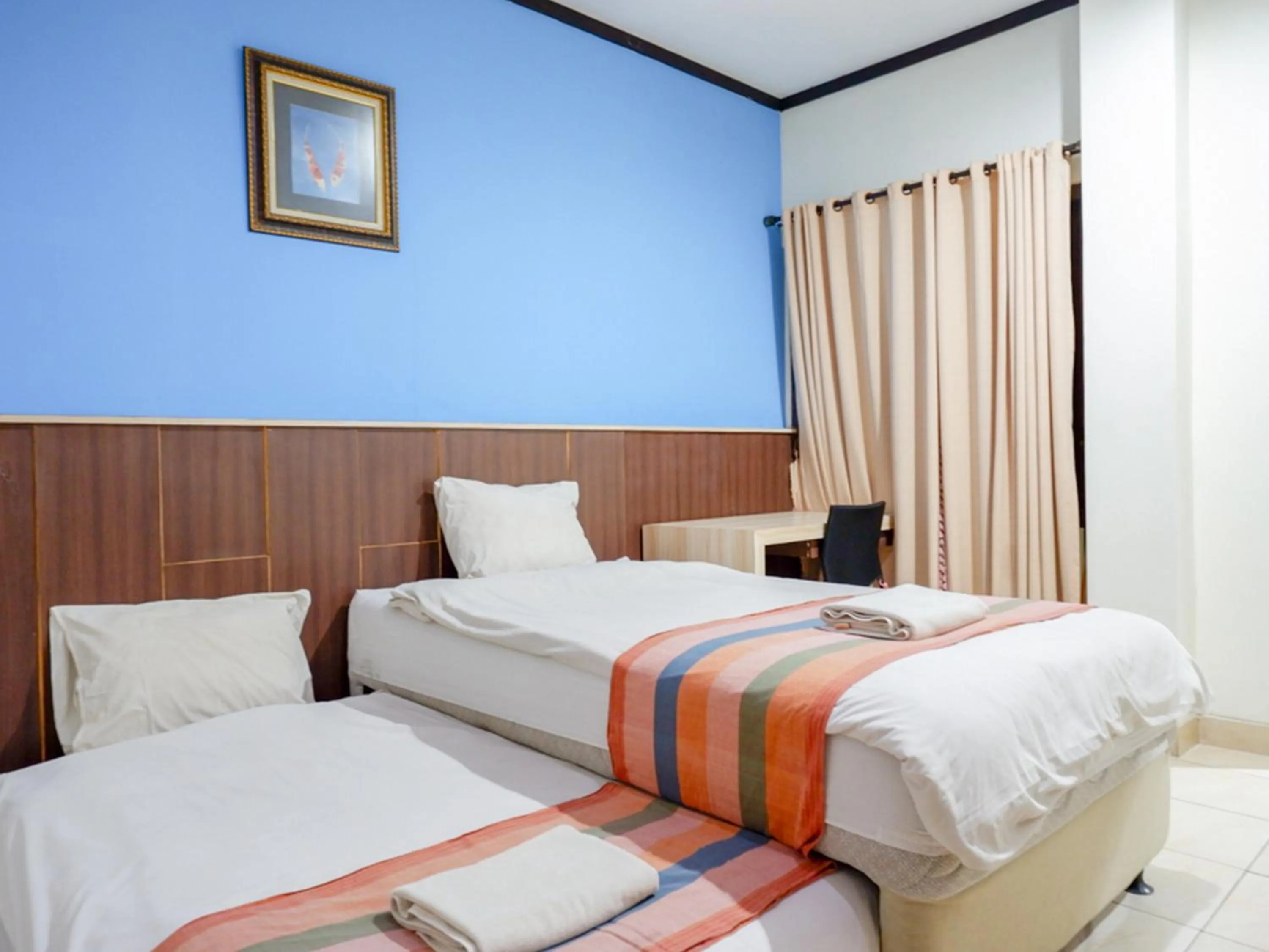 Bed in Pineapple Mansion Solo Mitra RedDoorz near RS JIH Solo