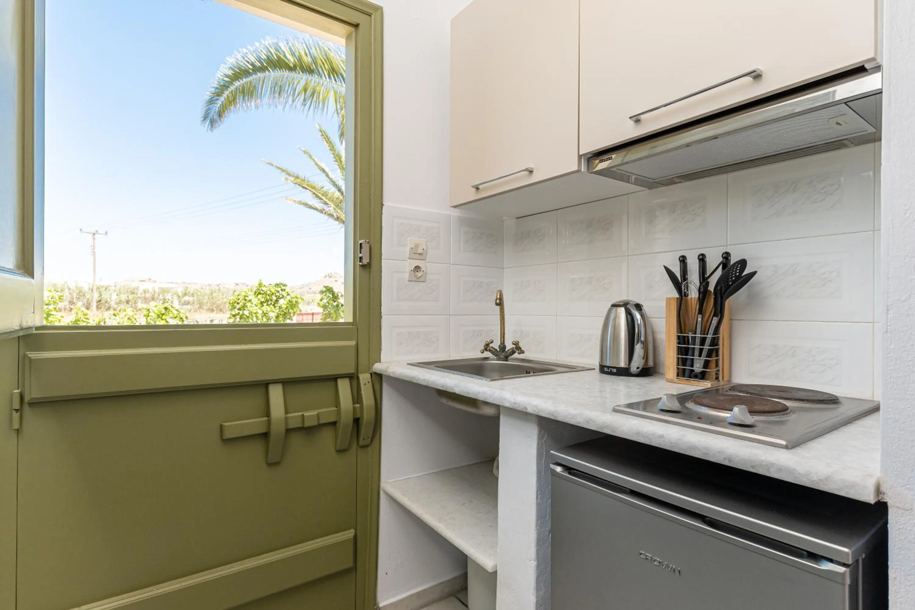 kitchen in Studios Vrettos Beachfront Hotel