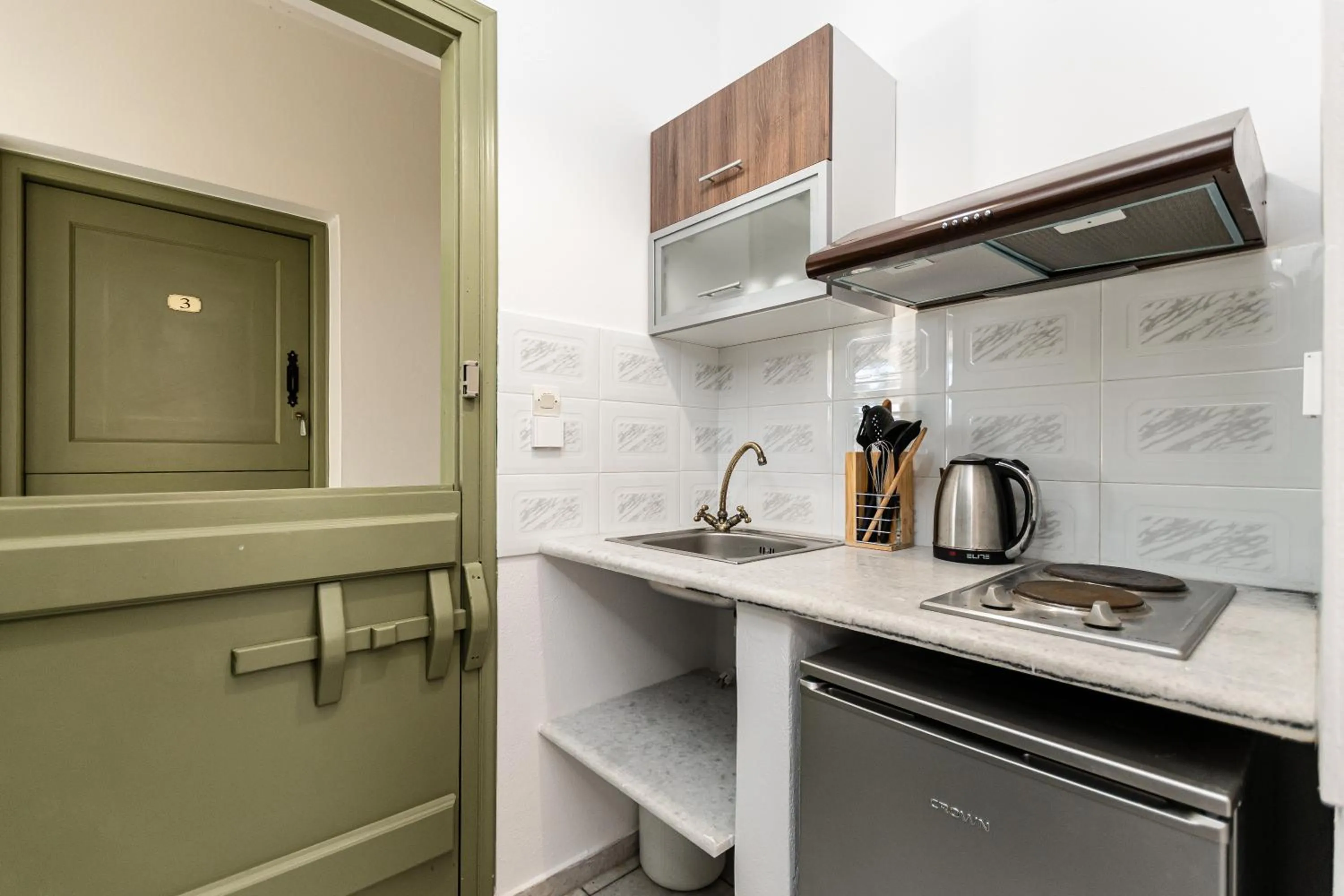 kitchen in Studios Vrettos Beachfront Hotel